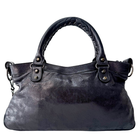 The First Black Leather Bag