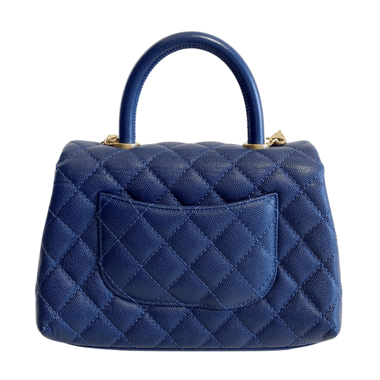 CHANEL Coco Handle Navy Grain Calf Leather Top Handle Bag with Gold Hardware, in Sold by HIVE PRELOVED Crossbody bags