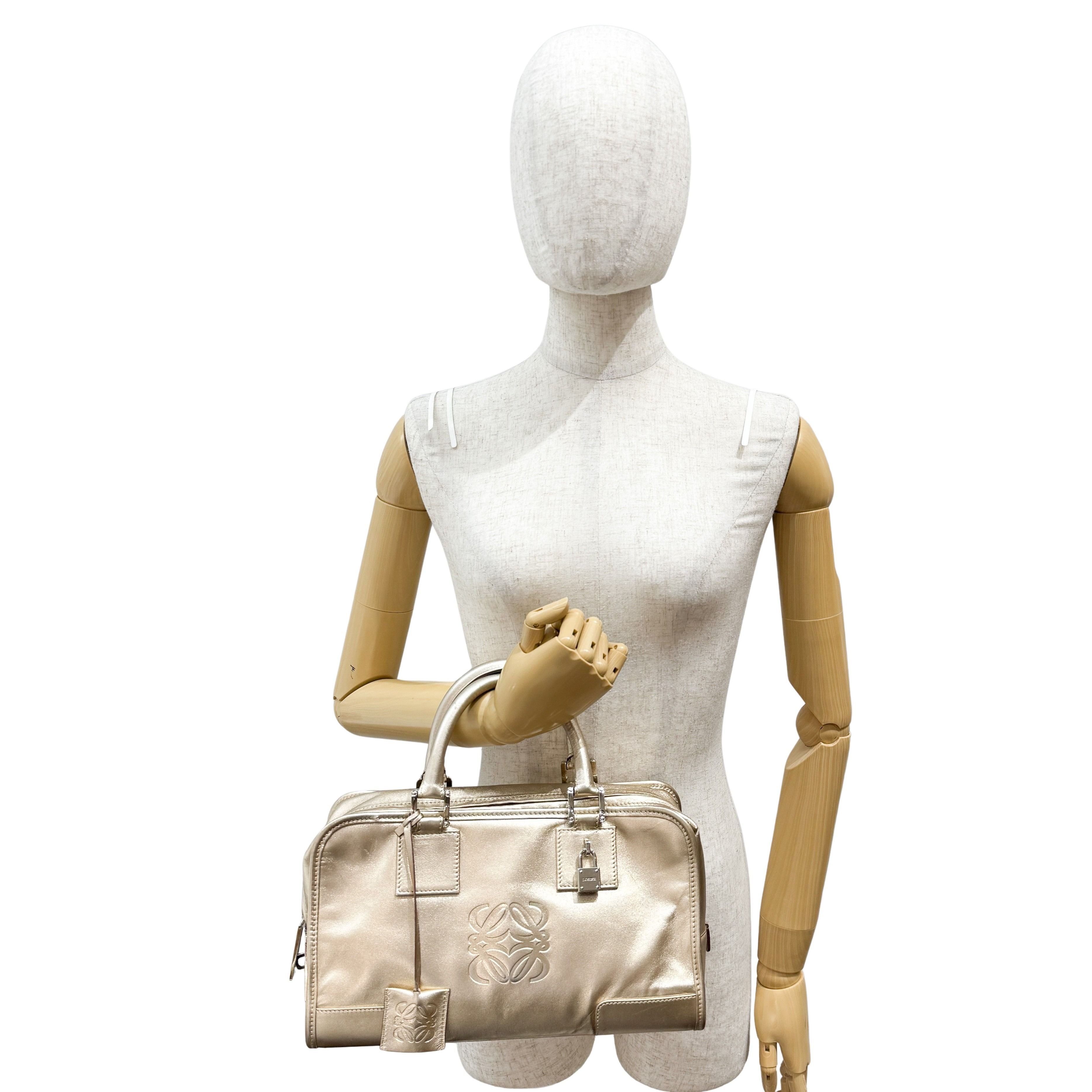 Anagram Gold Leather Hand Bag