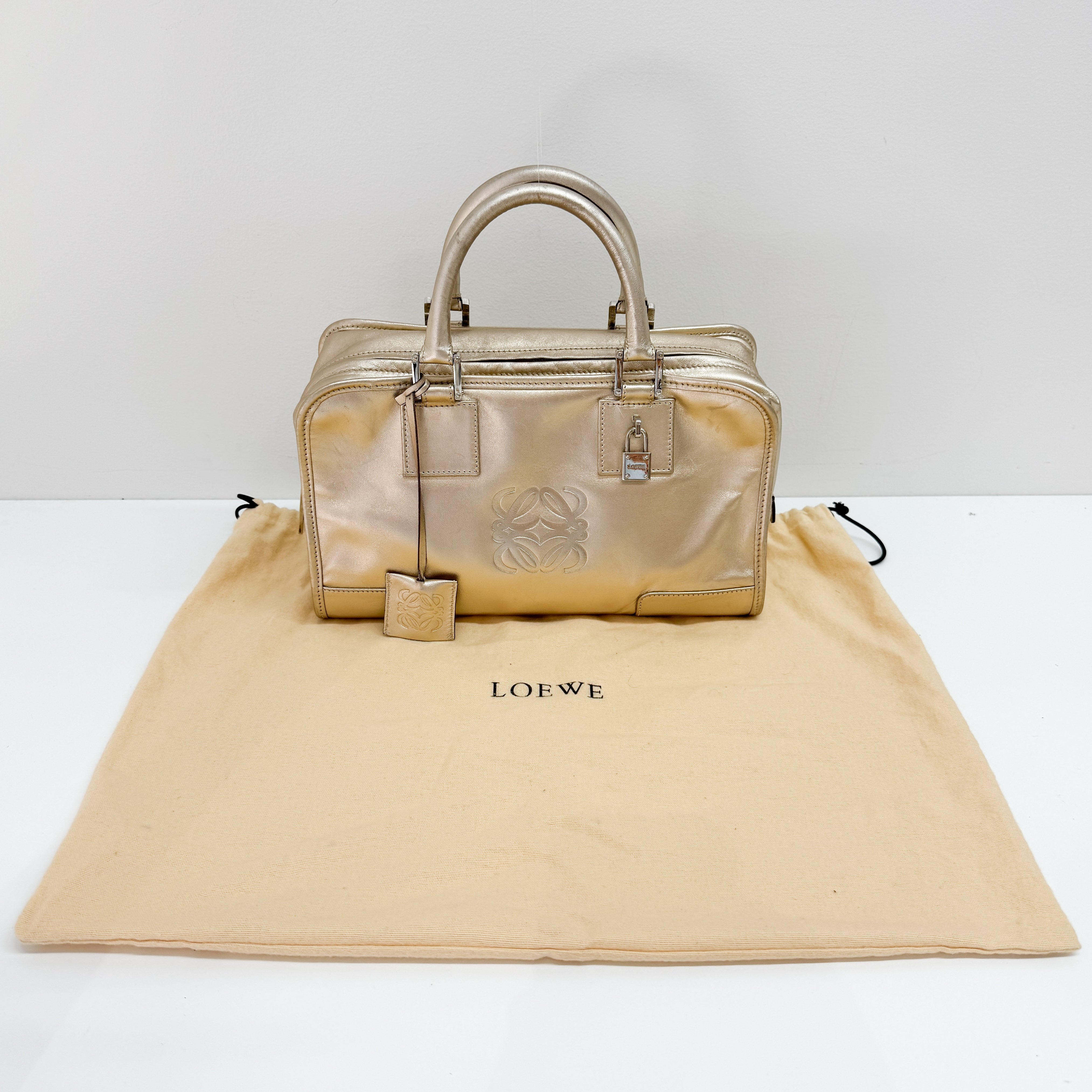 Anagram Gold Leather Hand Bag