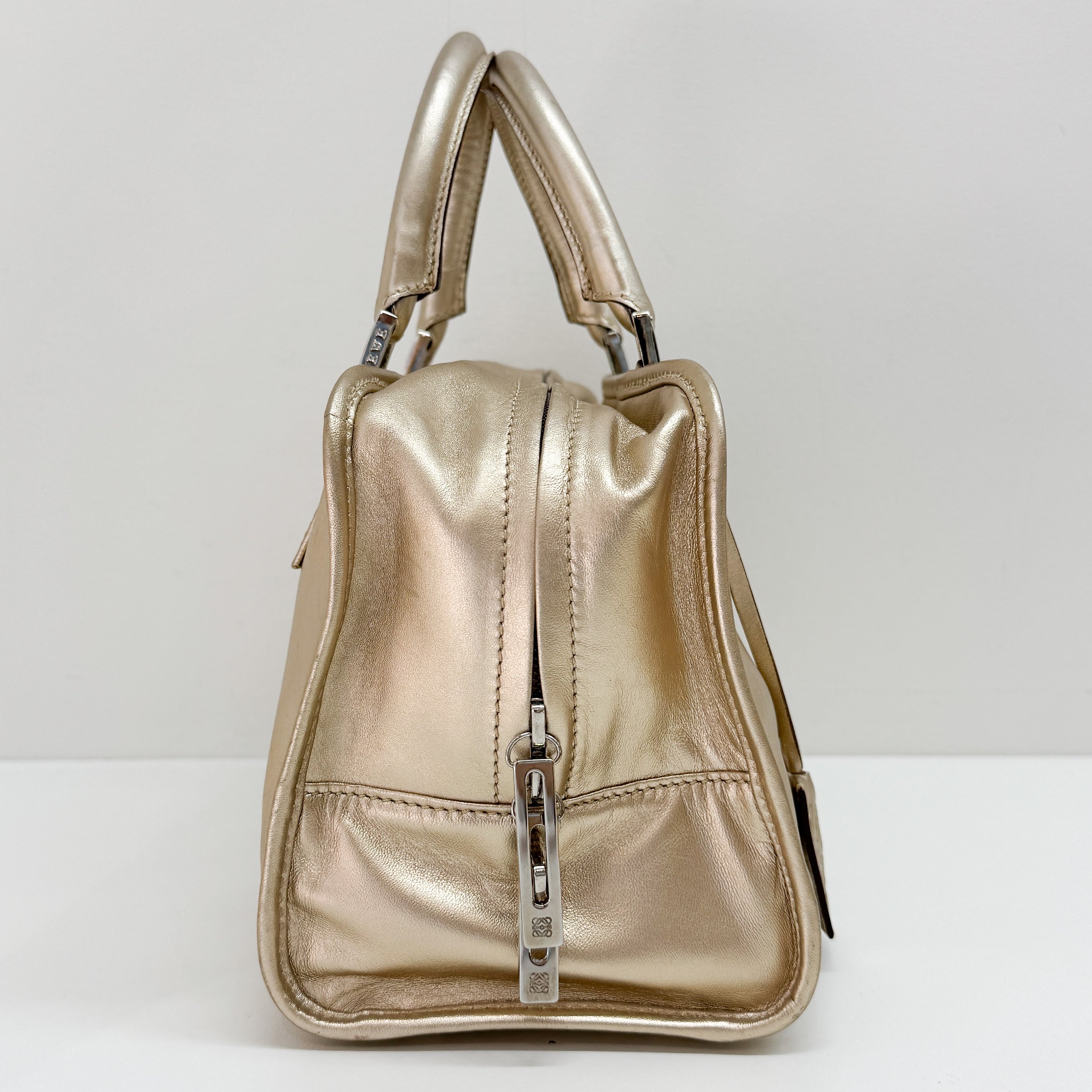 Anagram Gold Leather Hand Bag