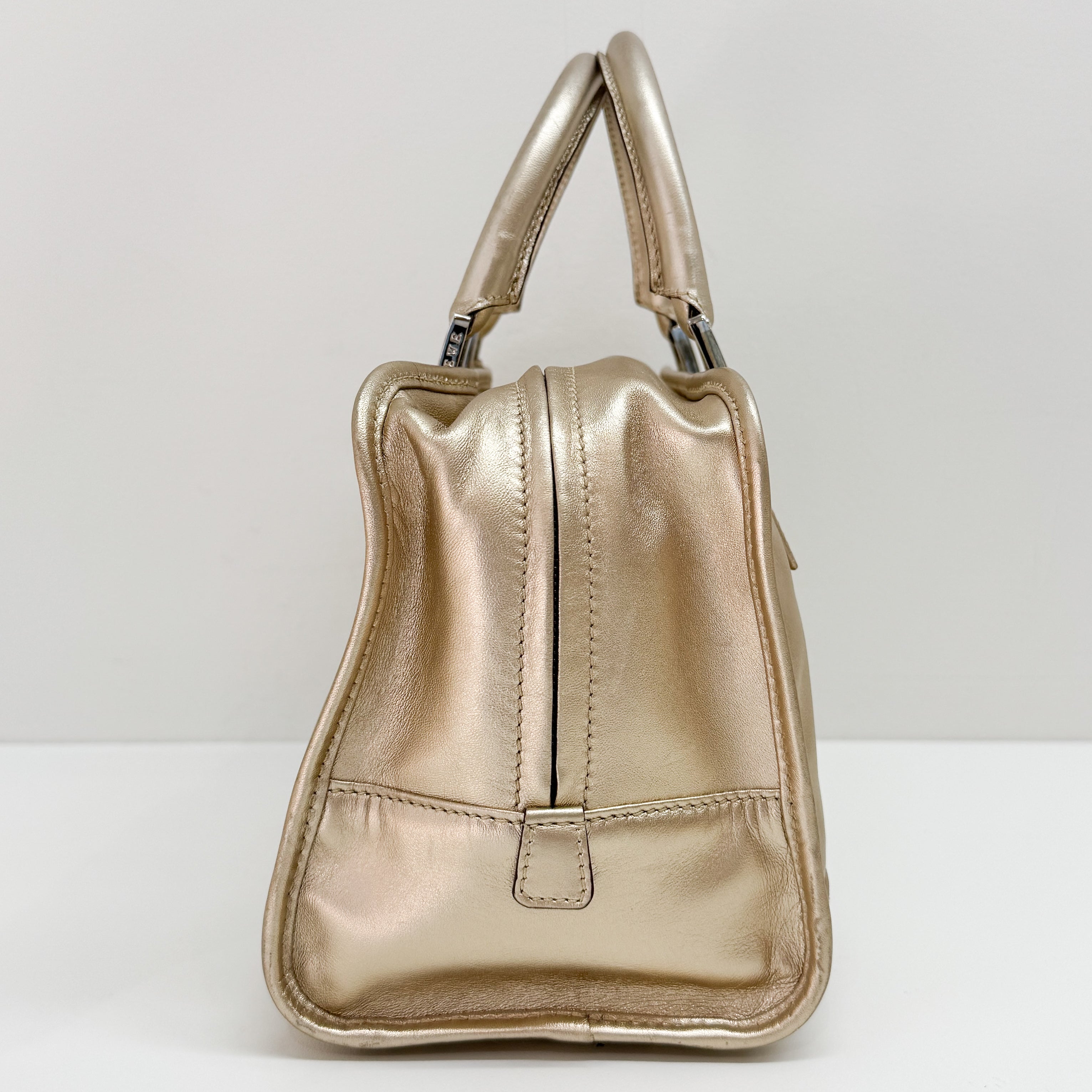 Anagram Gold Leather Hand Bag