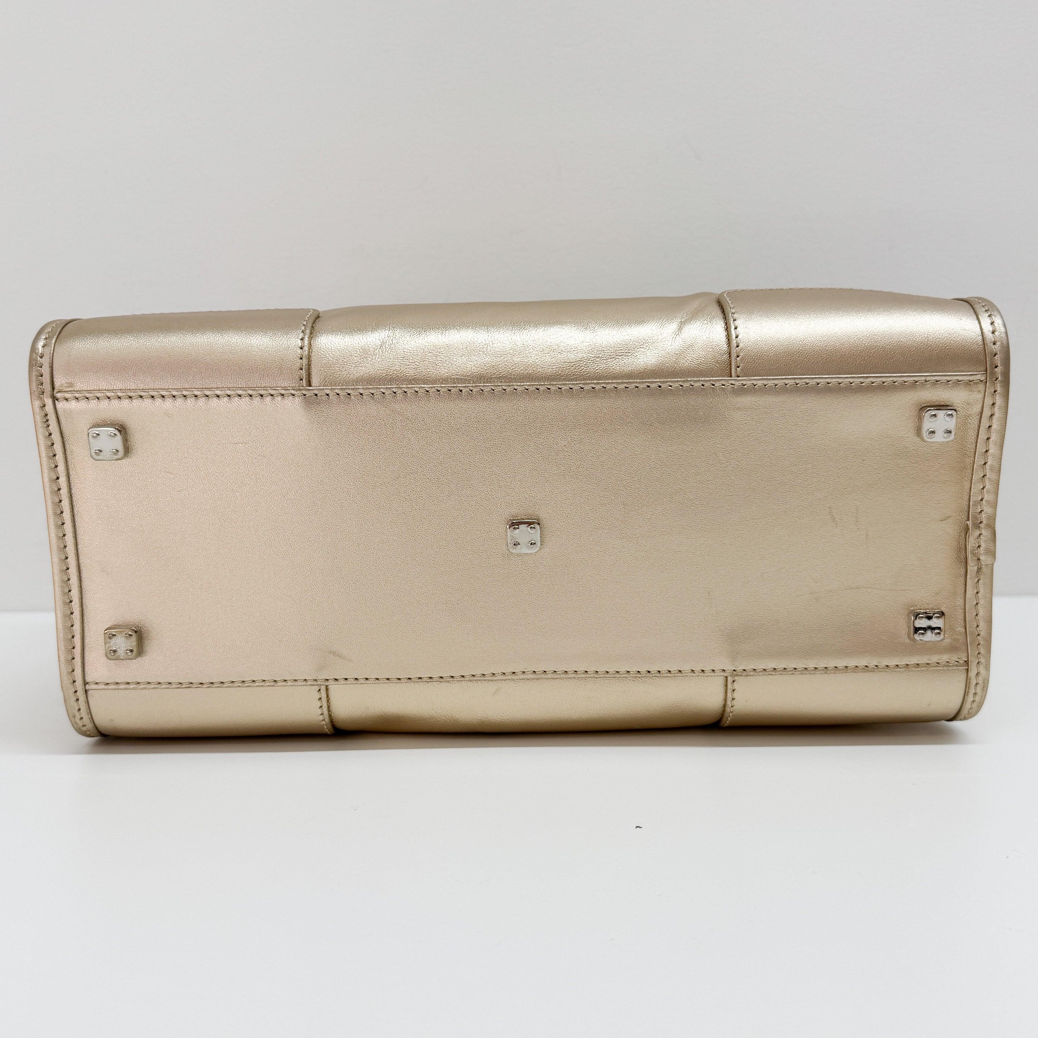 Anagram Gold Leather Hand Bag