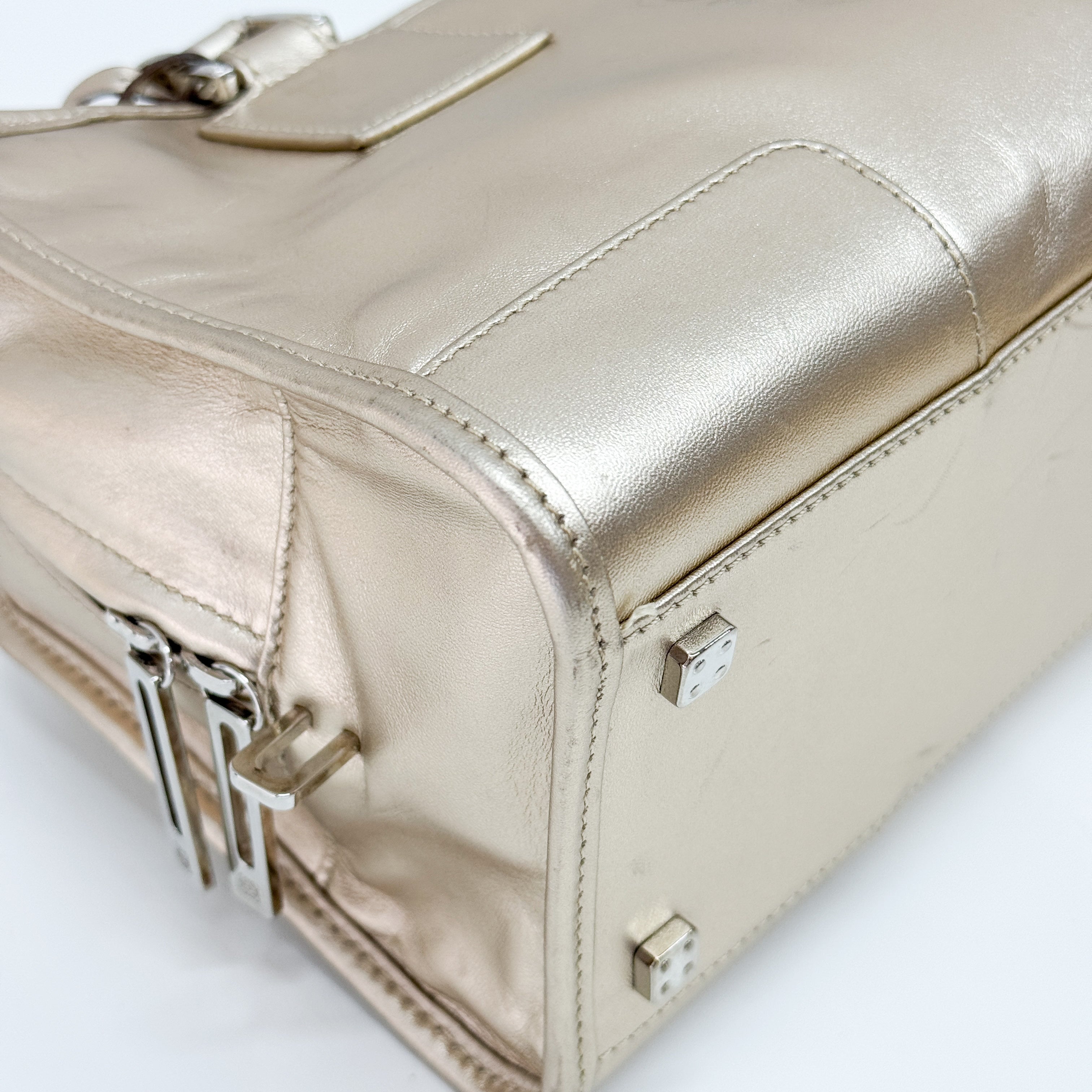 Anagram Gold Leather Hand Bag
