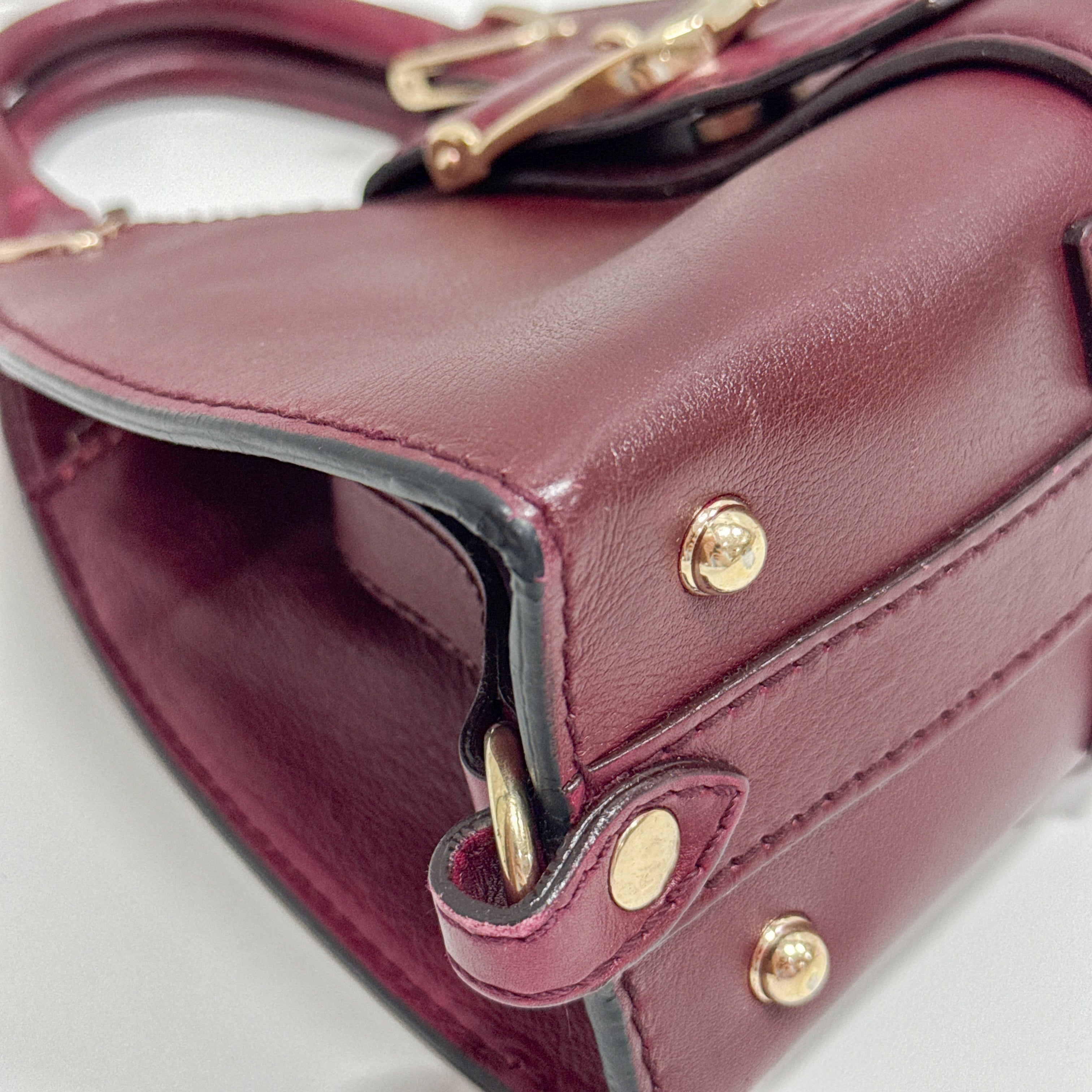 Stirrup Burgundy Leather Handbag