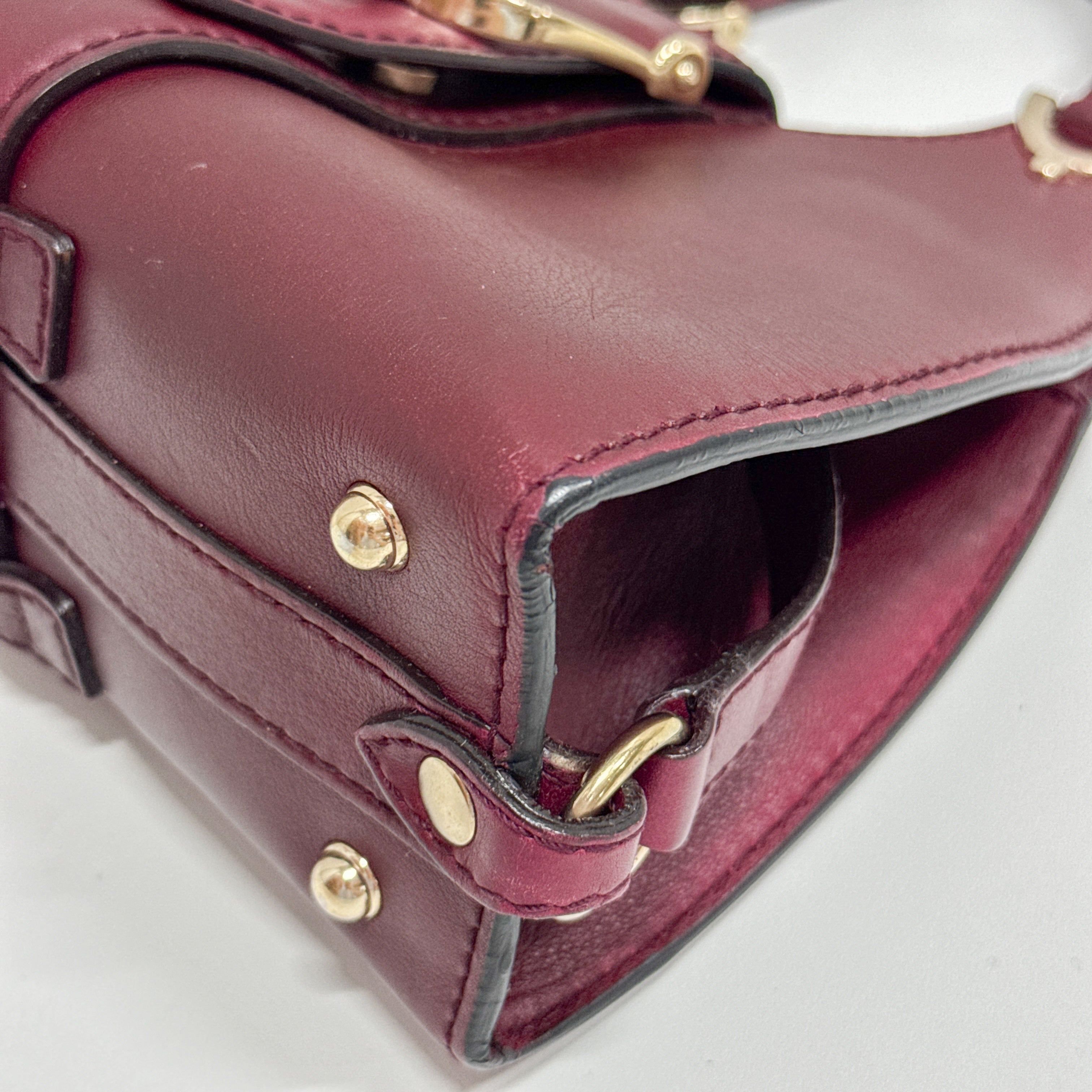 Stirrup Burgundy Leather Handbag