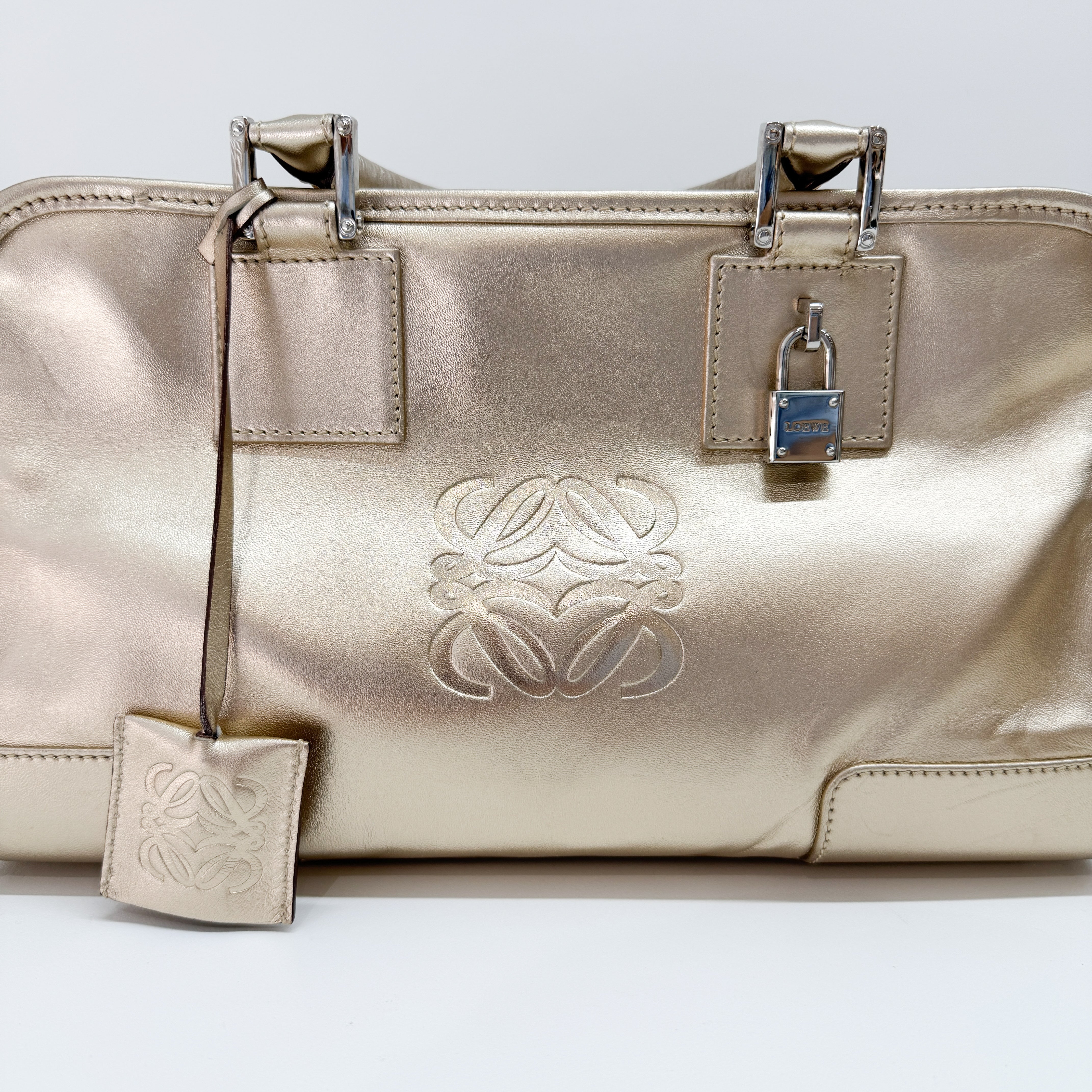 Anagram Gold Leather Hand Bag