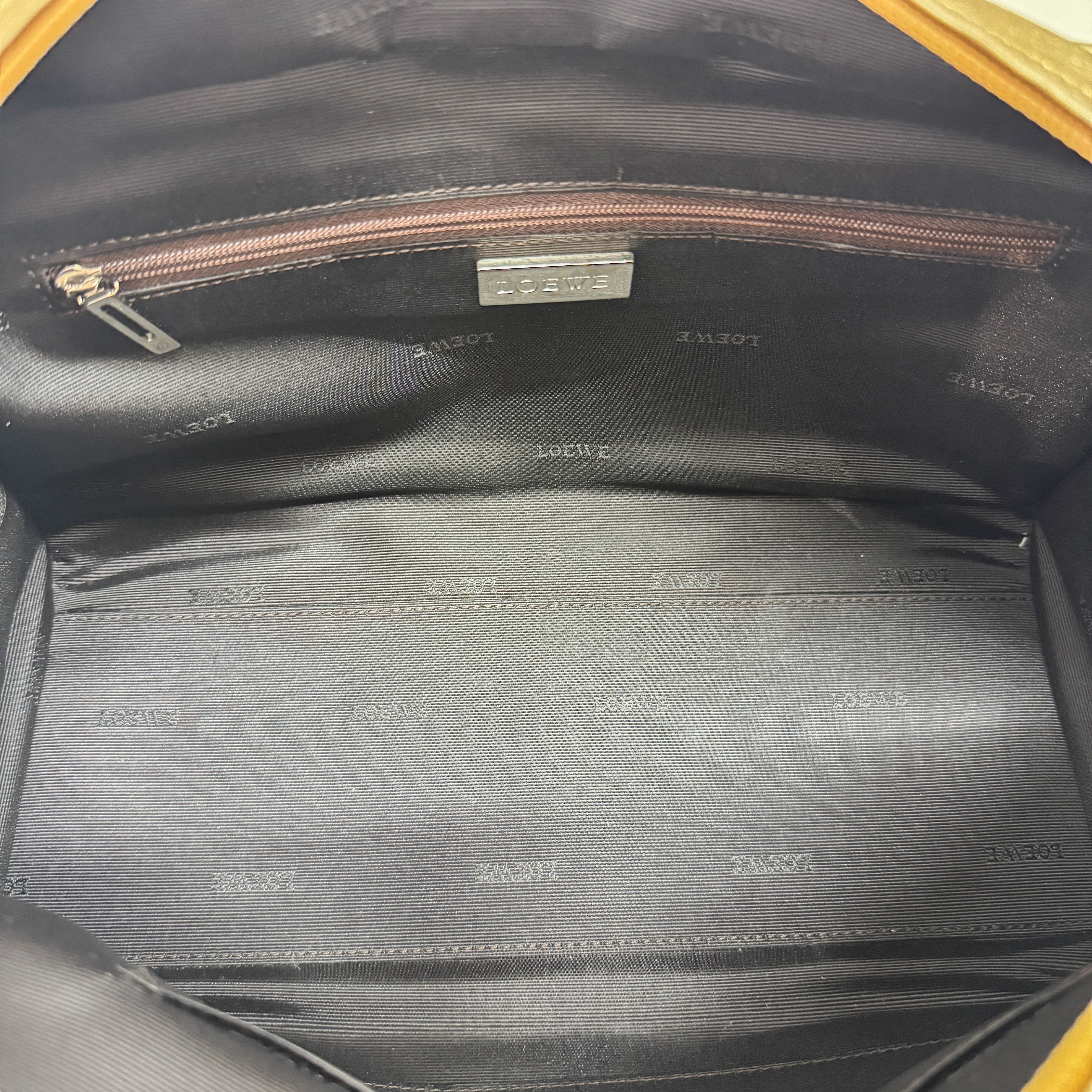 Anagram Gold Leather Hand Bag