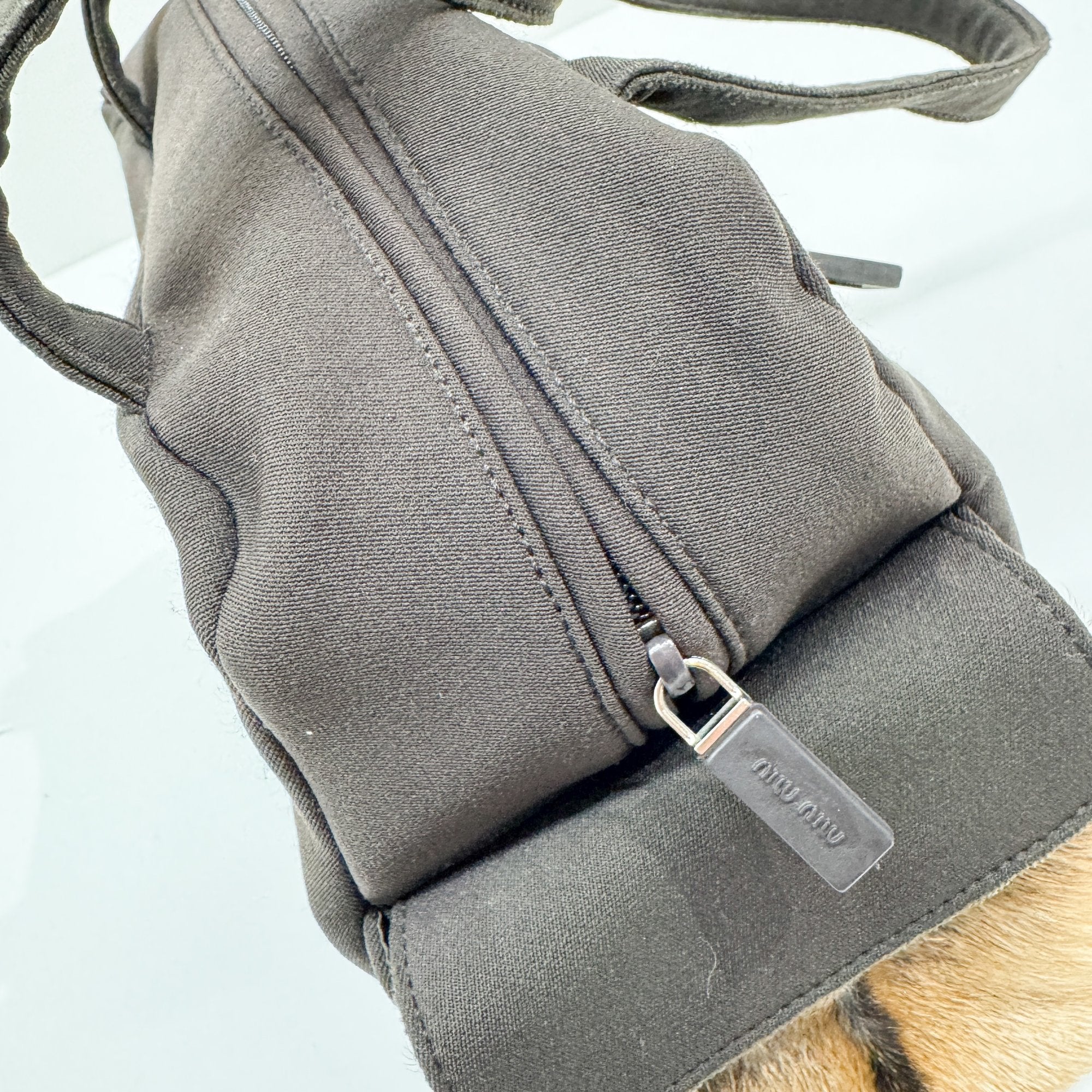 Pony Hair Side Pockets Black Neoprene Hand Bag