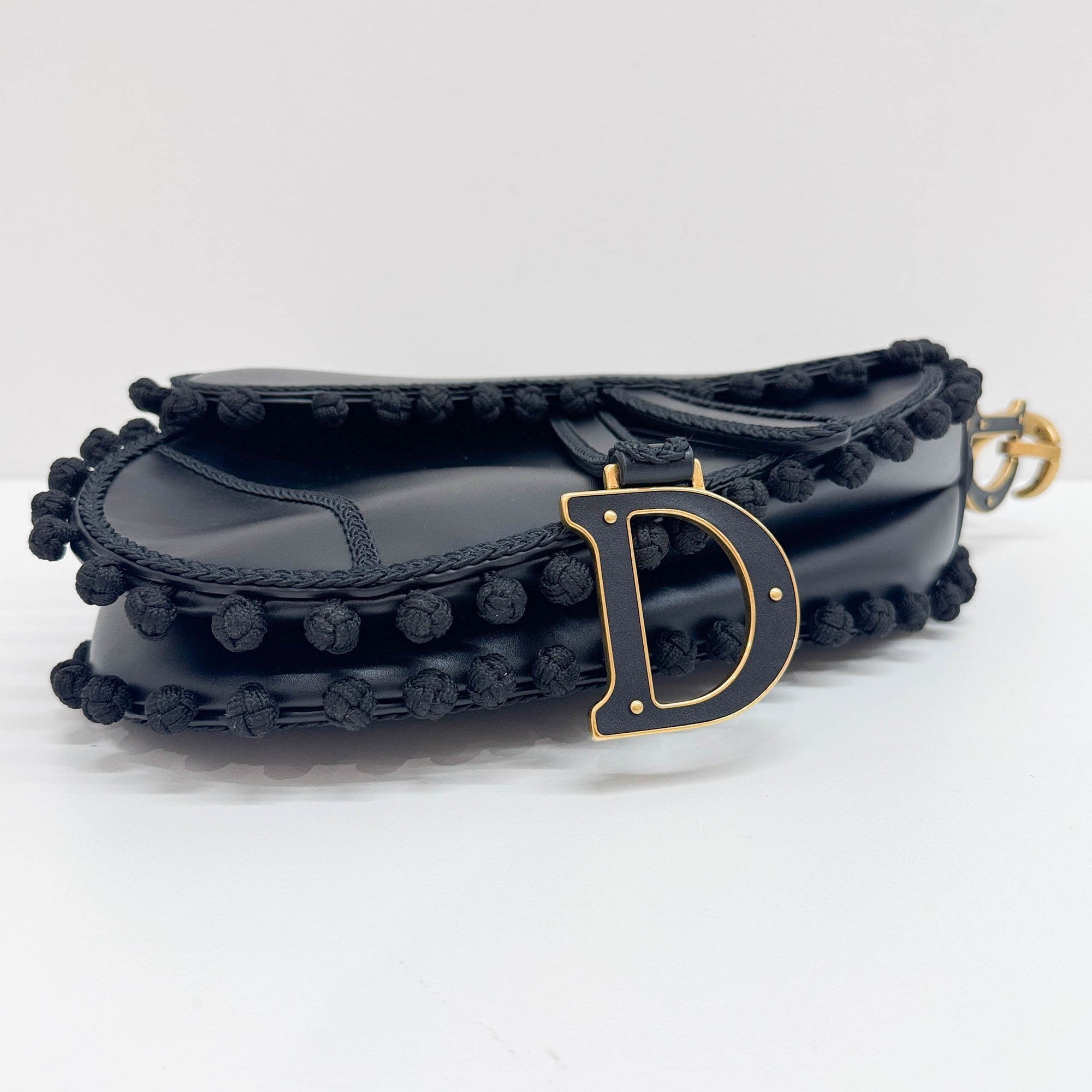 Saddle Braided Pom Pom Trim Black Leather Shoulder Bag