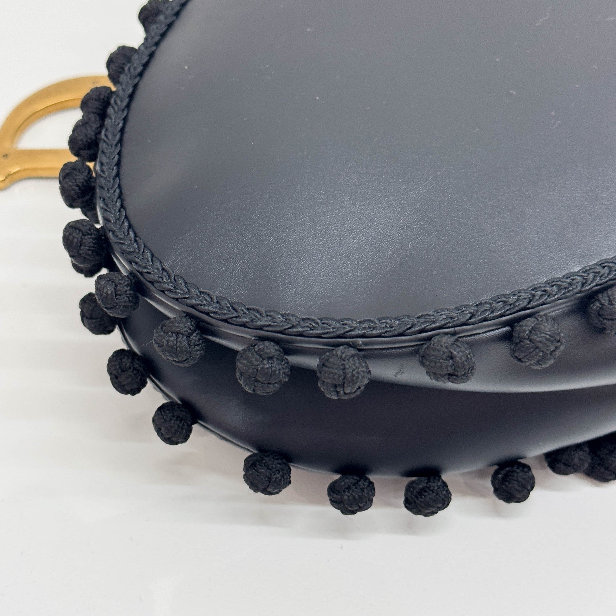 Saddle Braided Pom Pom Trim Black Leather Shoulder Bag