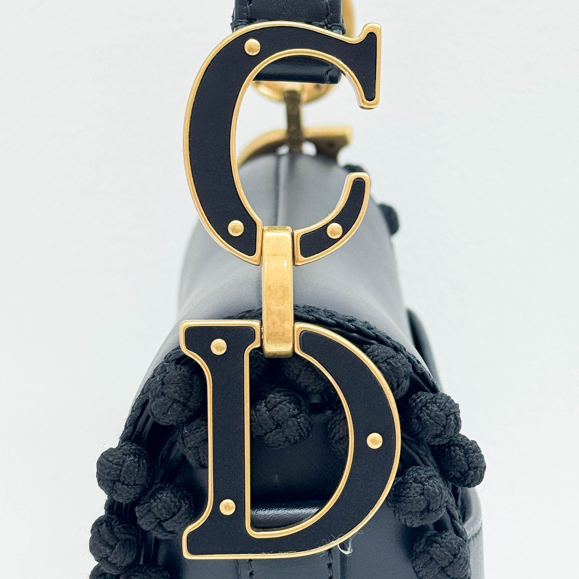 Saddle Braided Pom Pom Trim Black Leather Shoulder Bag