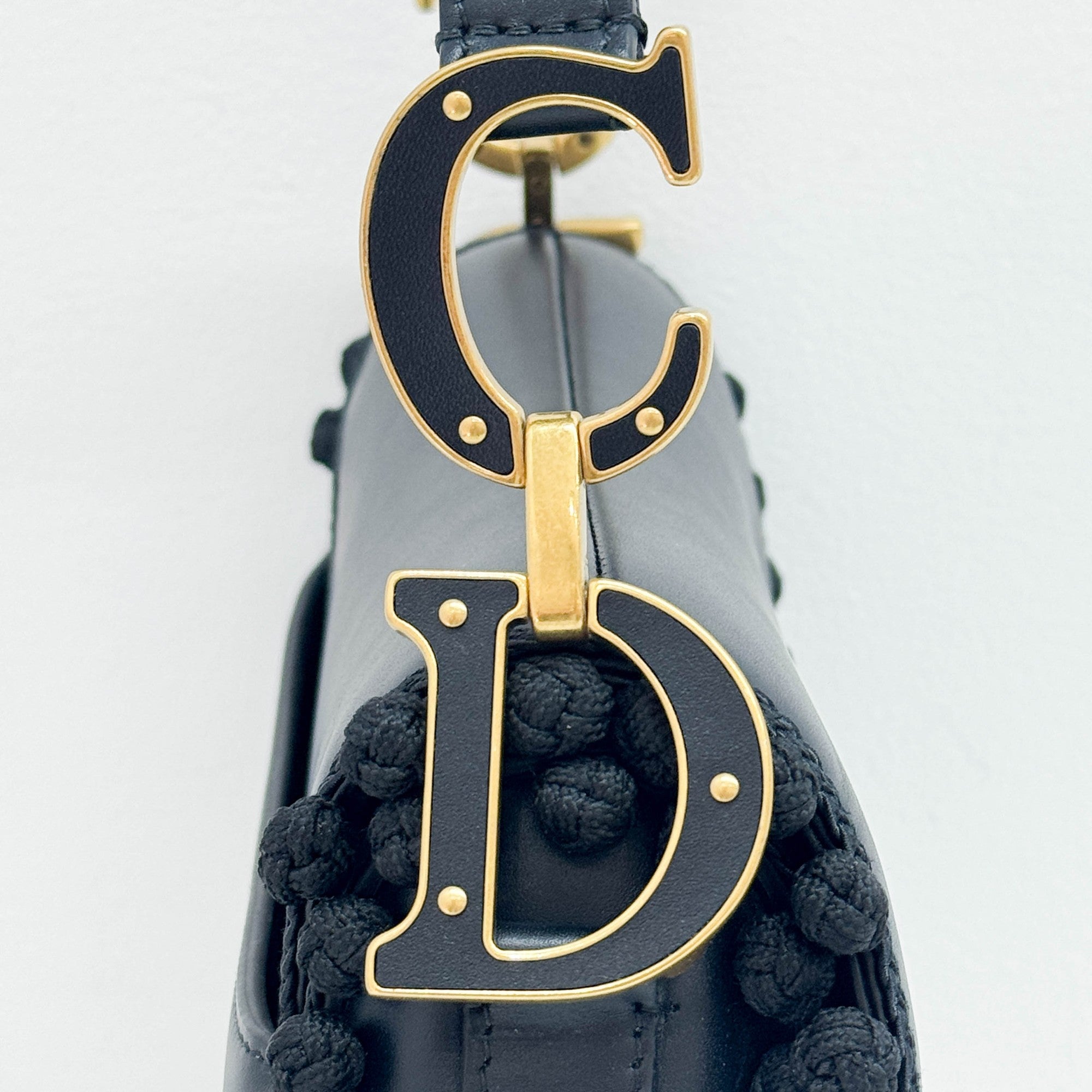 Saddle Braided Pom Pom Trim Black Leather Shoulder Bag