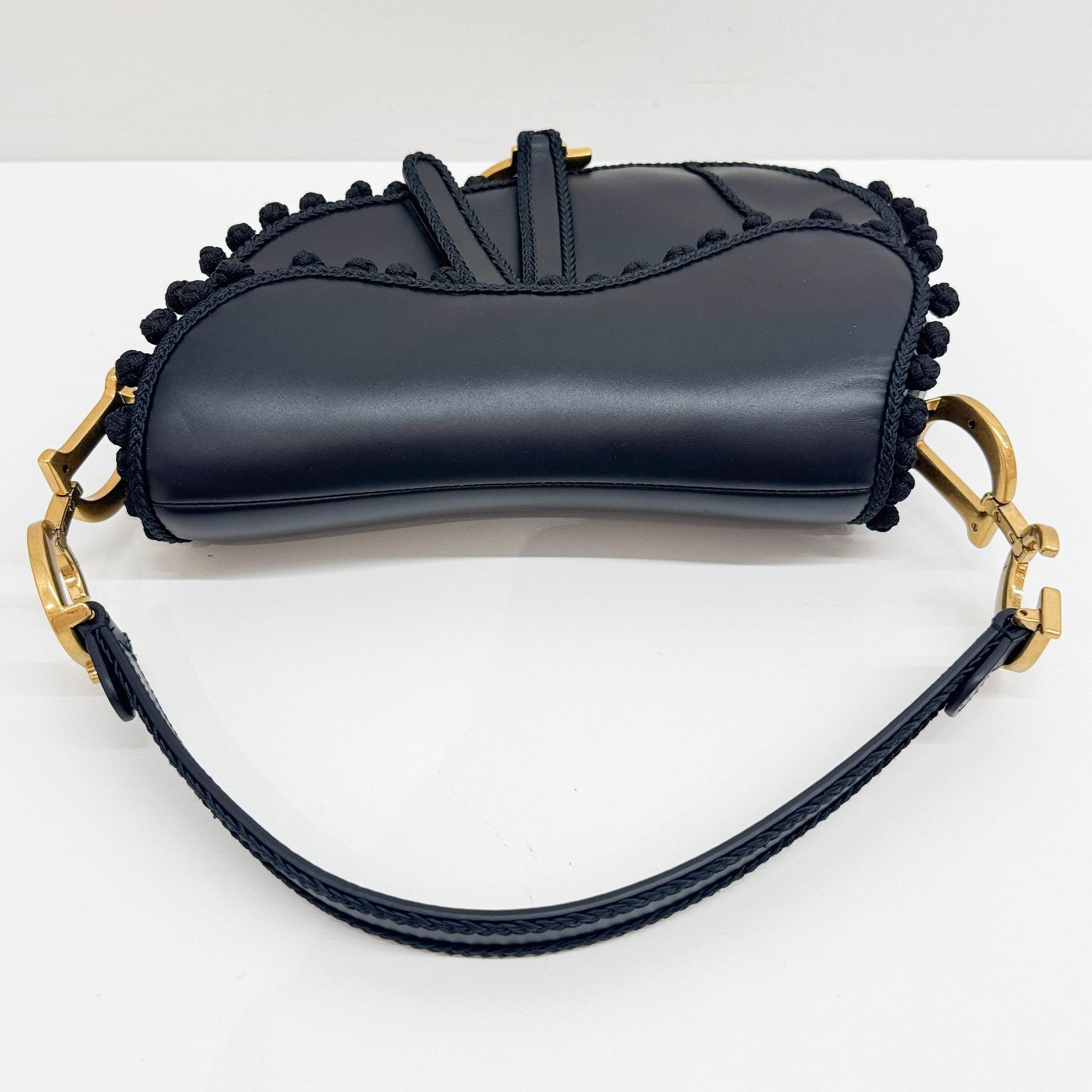 Saddle Braided Pom Pom Trim Black Leather Shoulder Bag