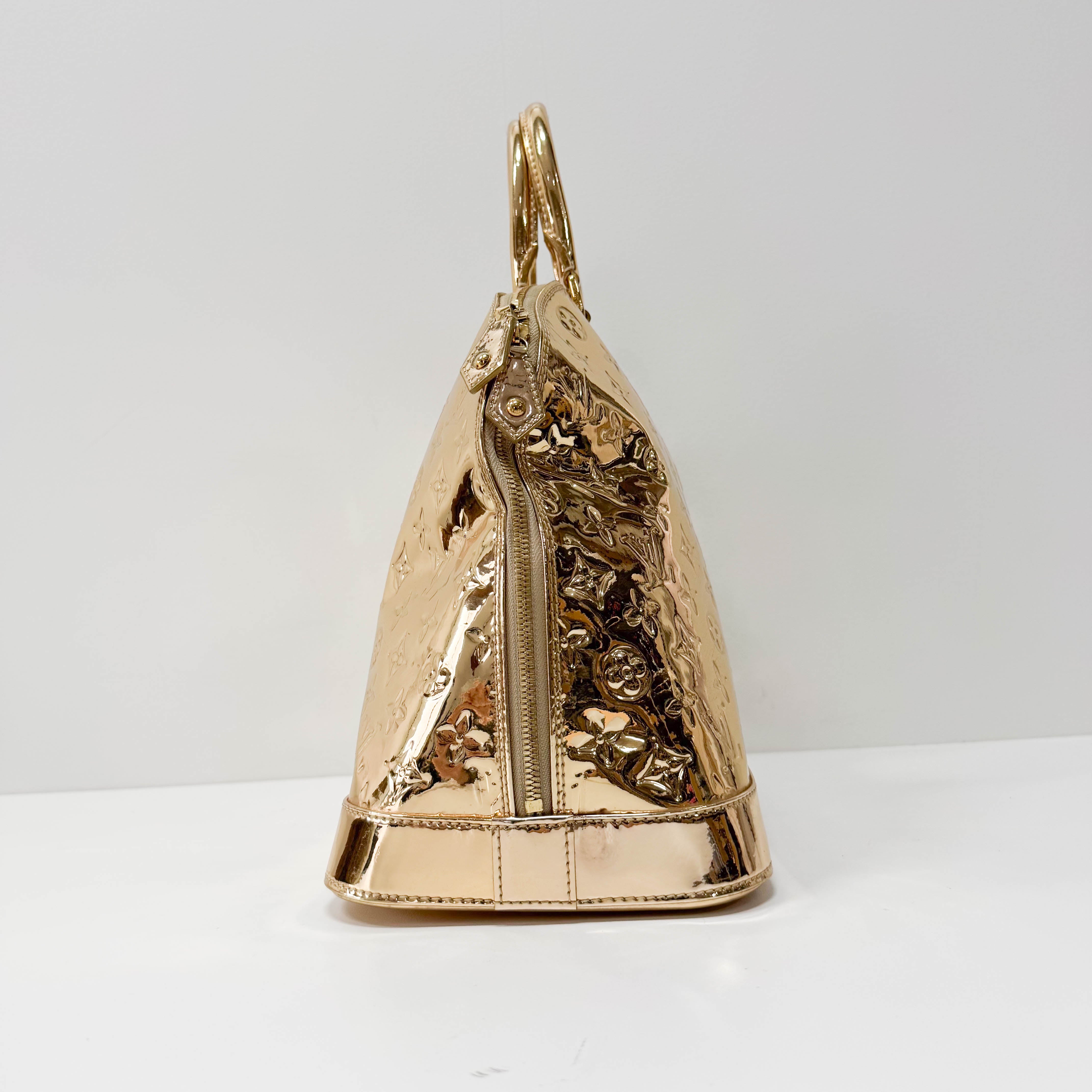 Mirroir Alma GM Monogram Gold Canvas Handbag