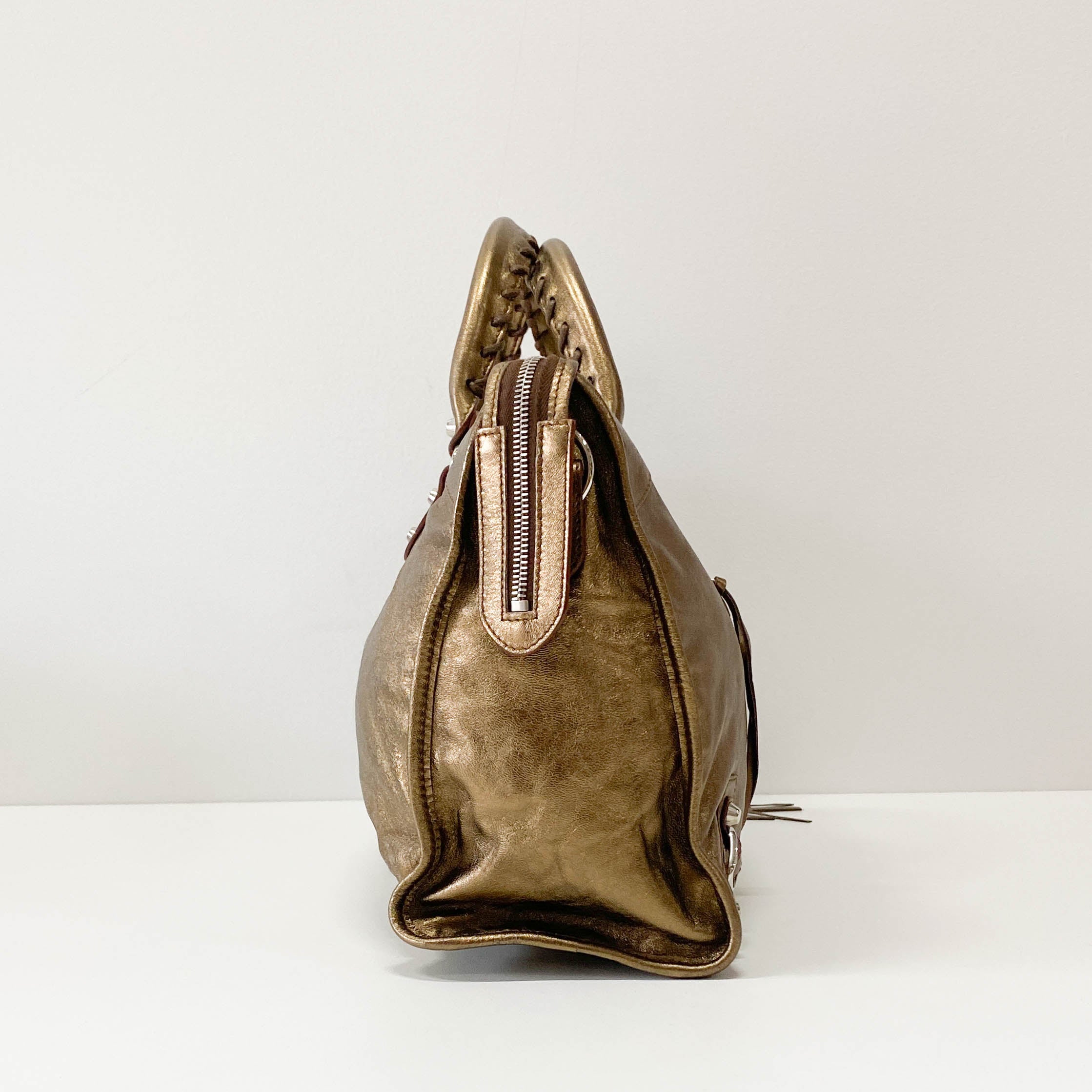 The City Gold Leather Hand bag