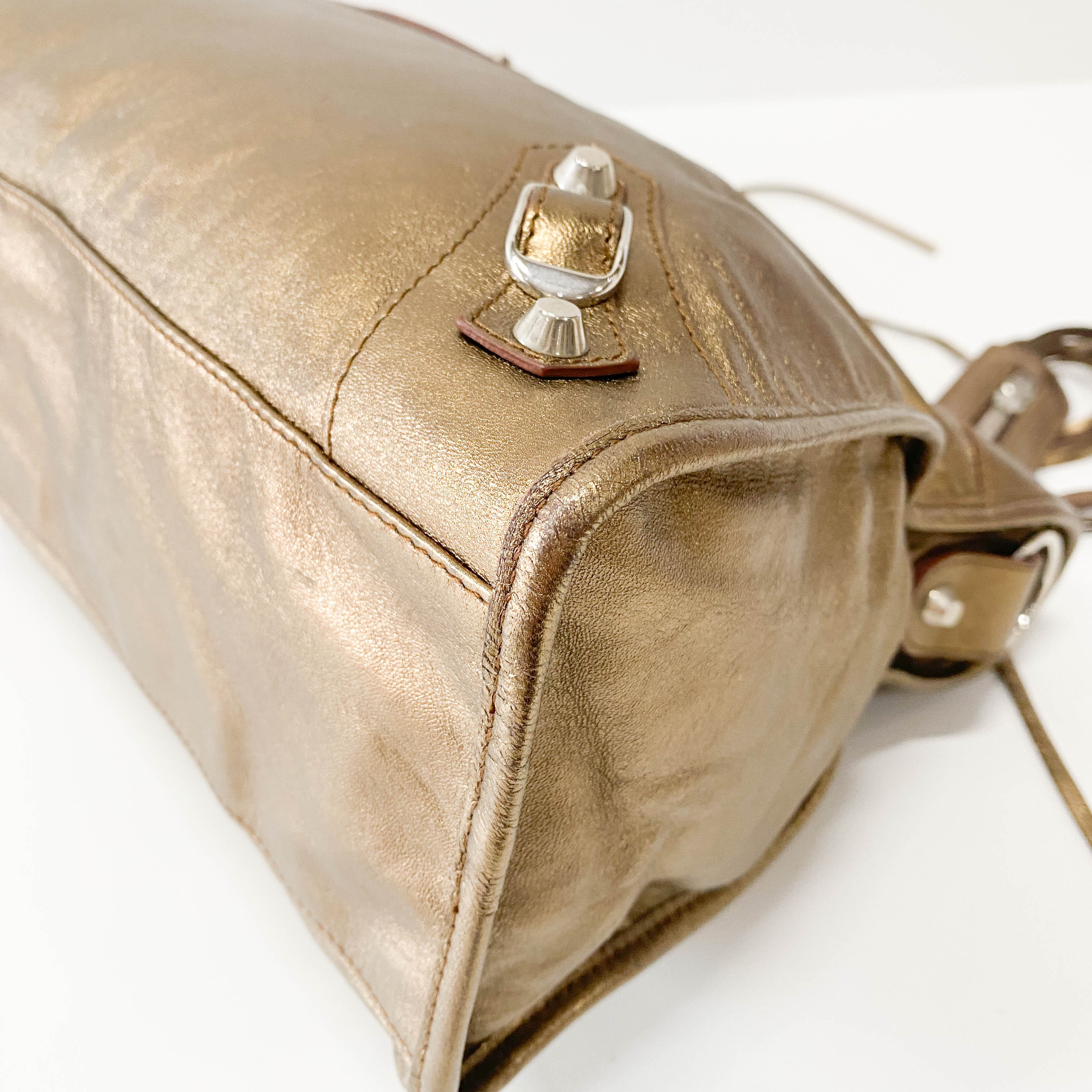 The City Gold Leather Hand bag