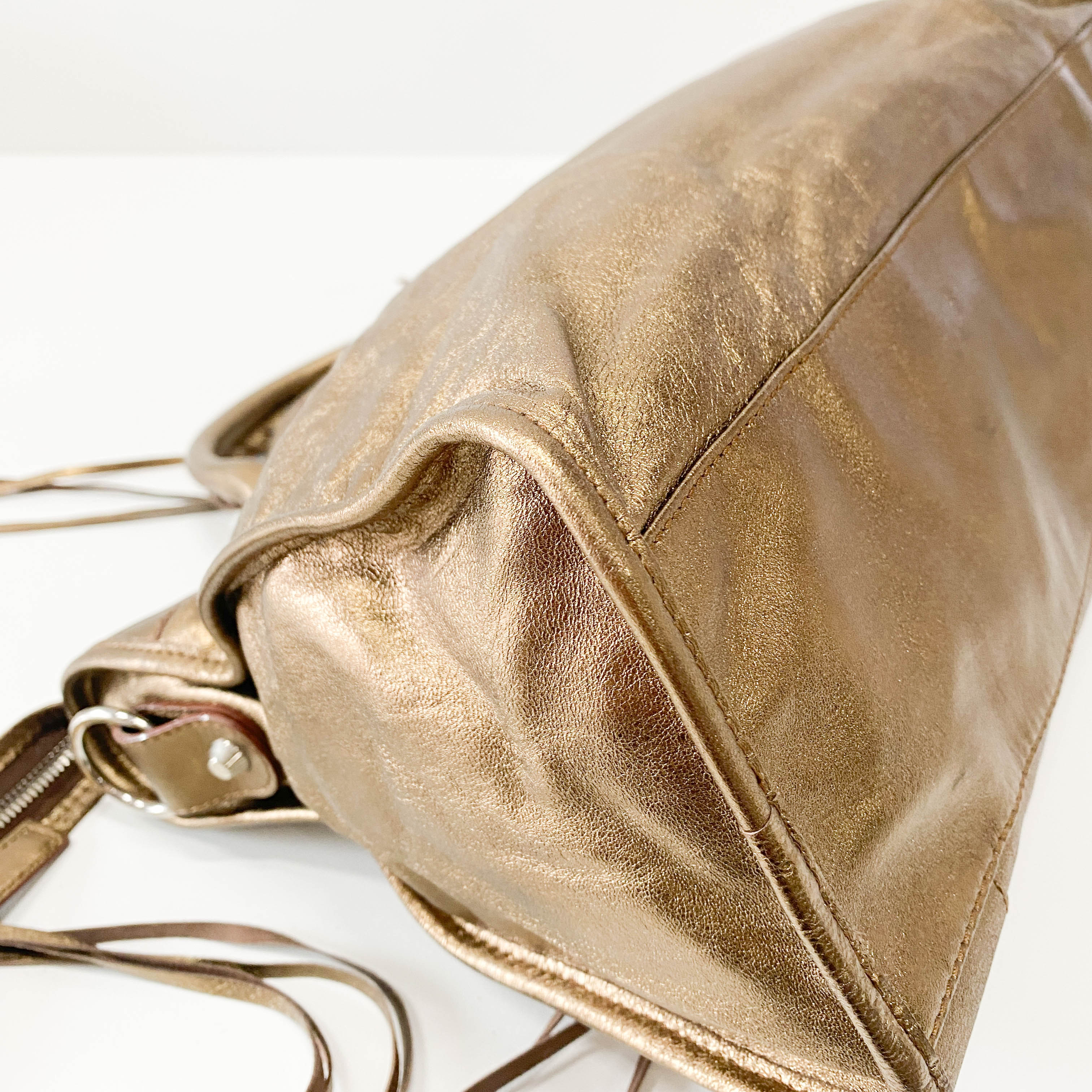 The City Gold Leather Hand bag