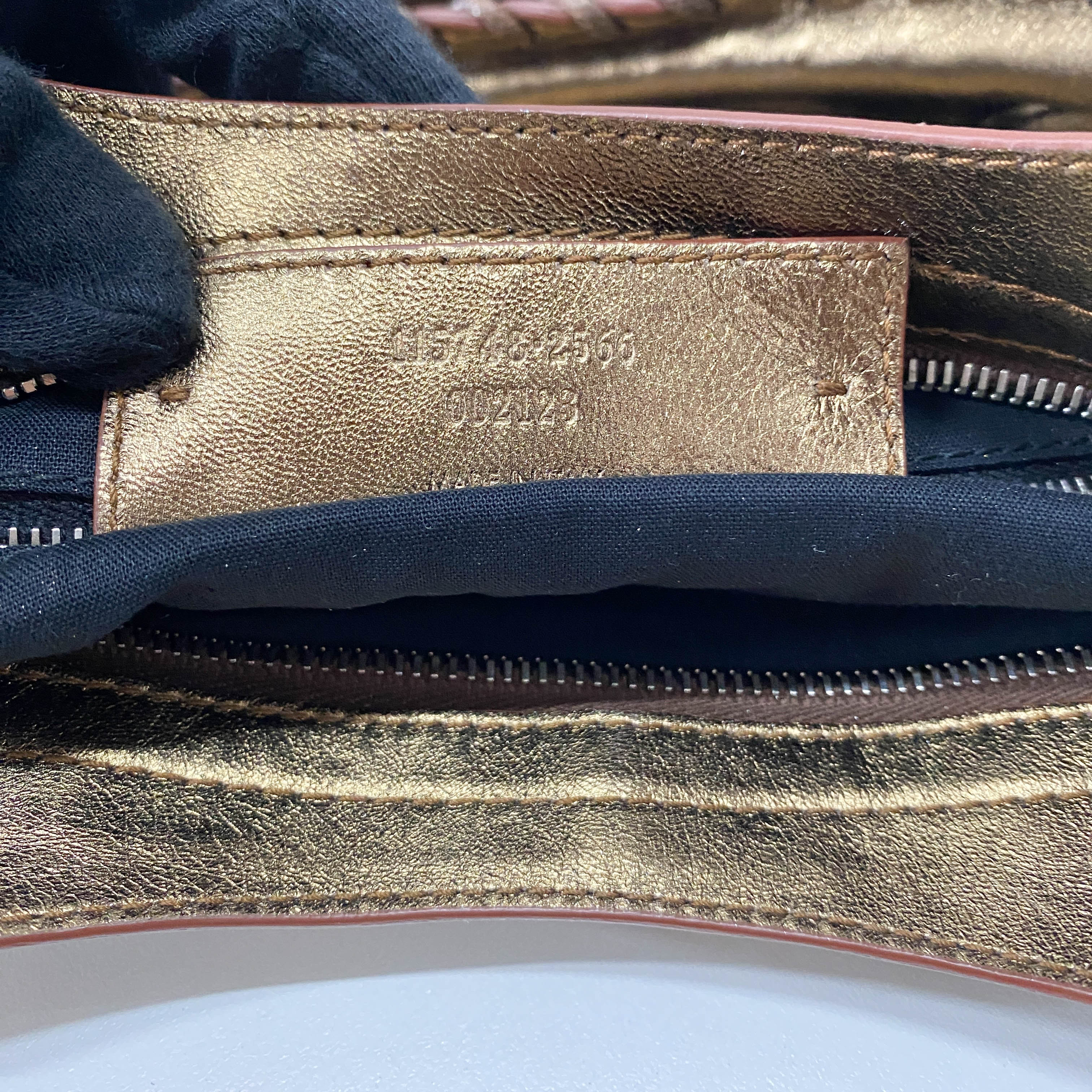 The City Gold Leather Hand bag