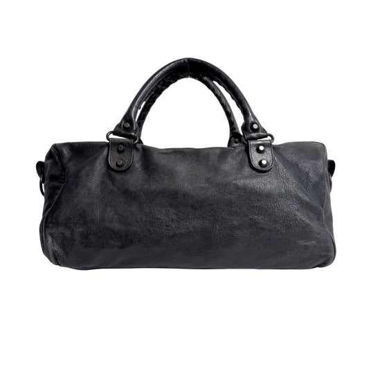 The First Black Leather Hand Bag