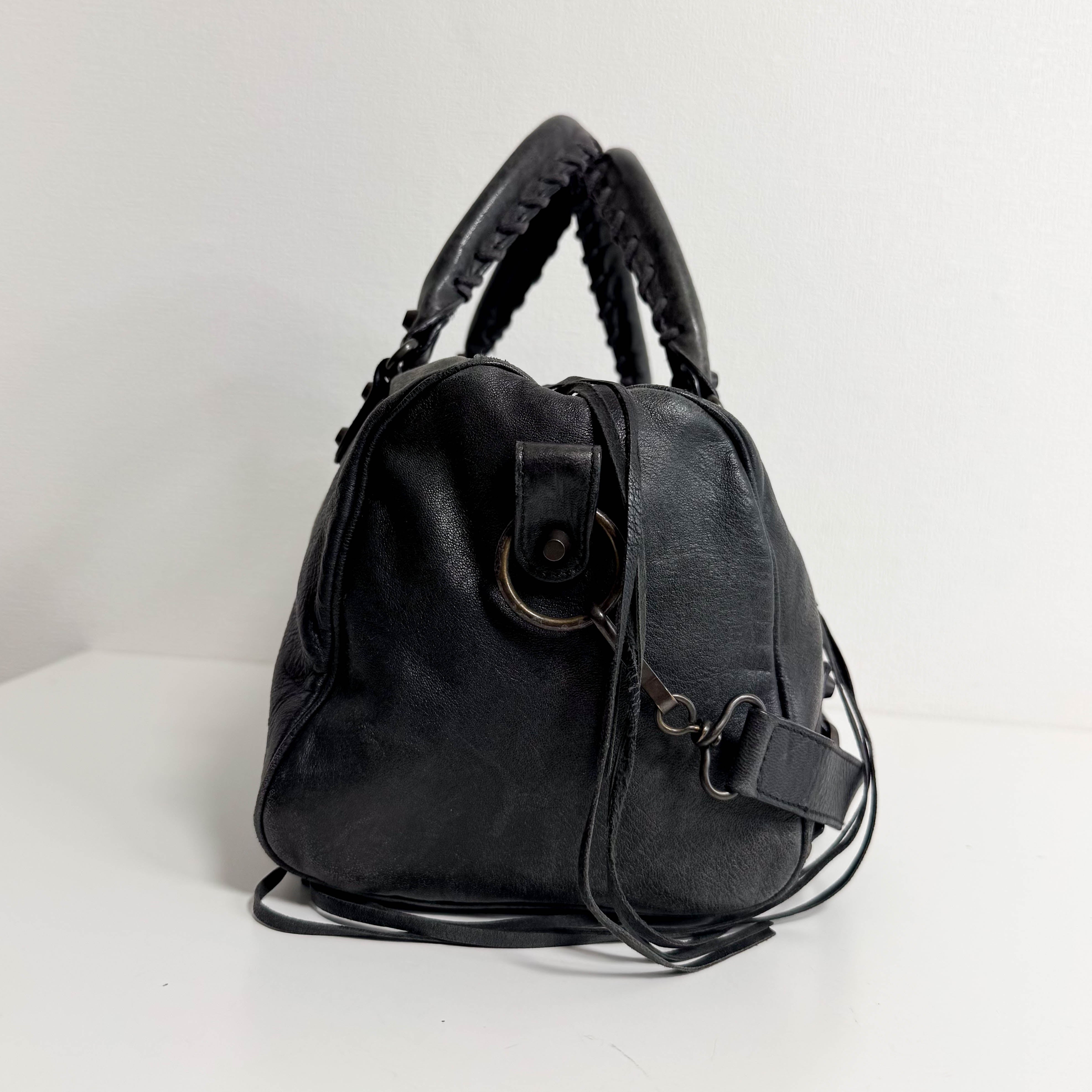 The First Black Leather Hand Bag