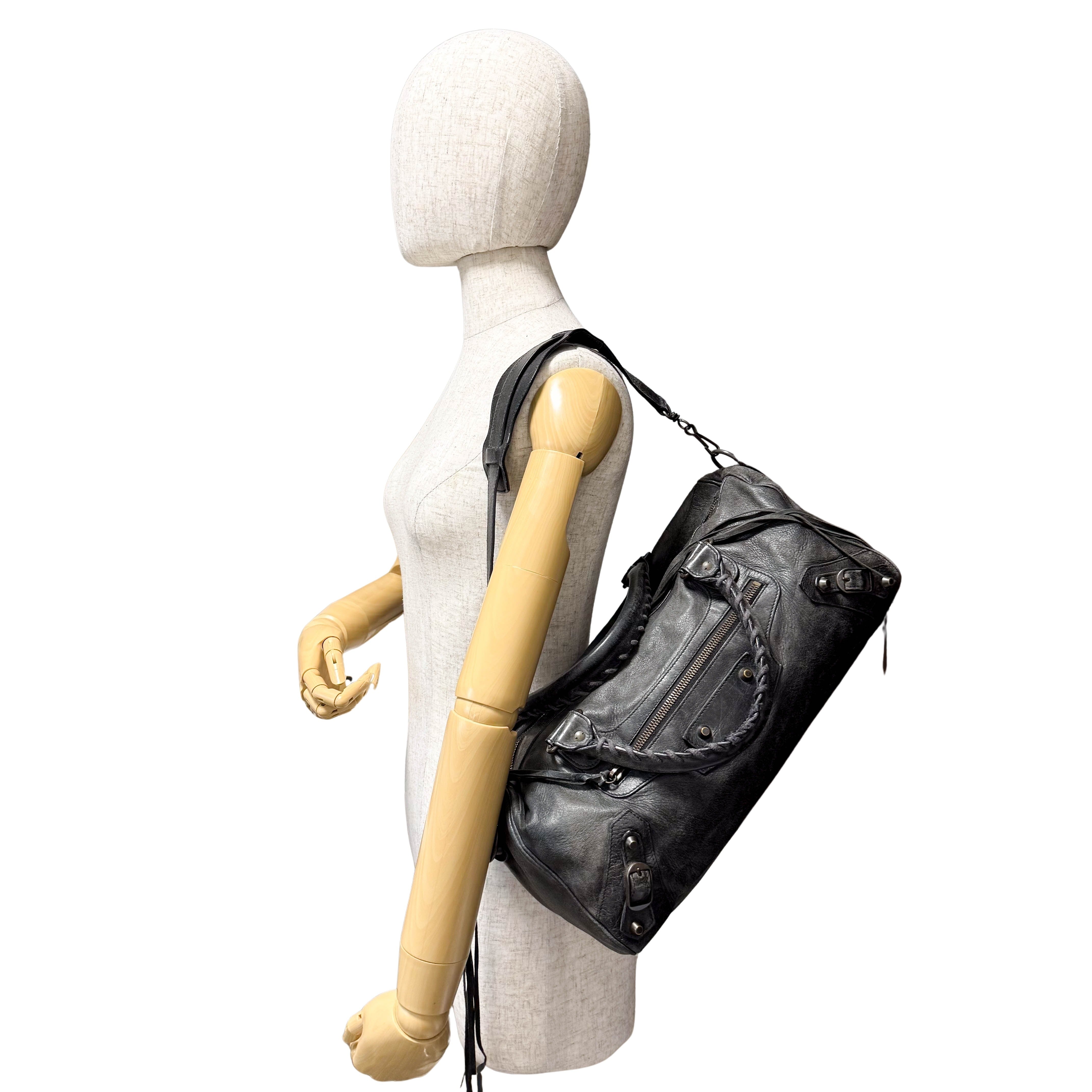 The First Black Leather Hand Bag