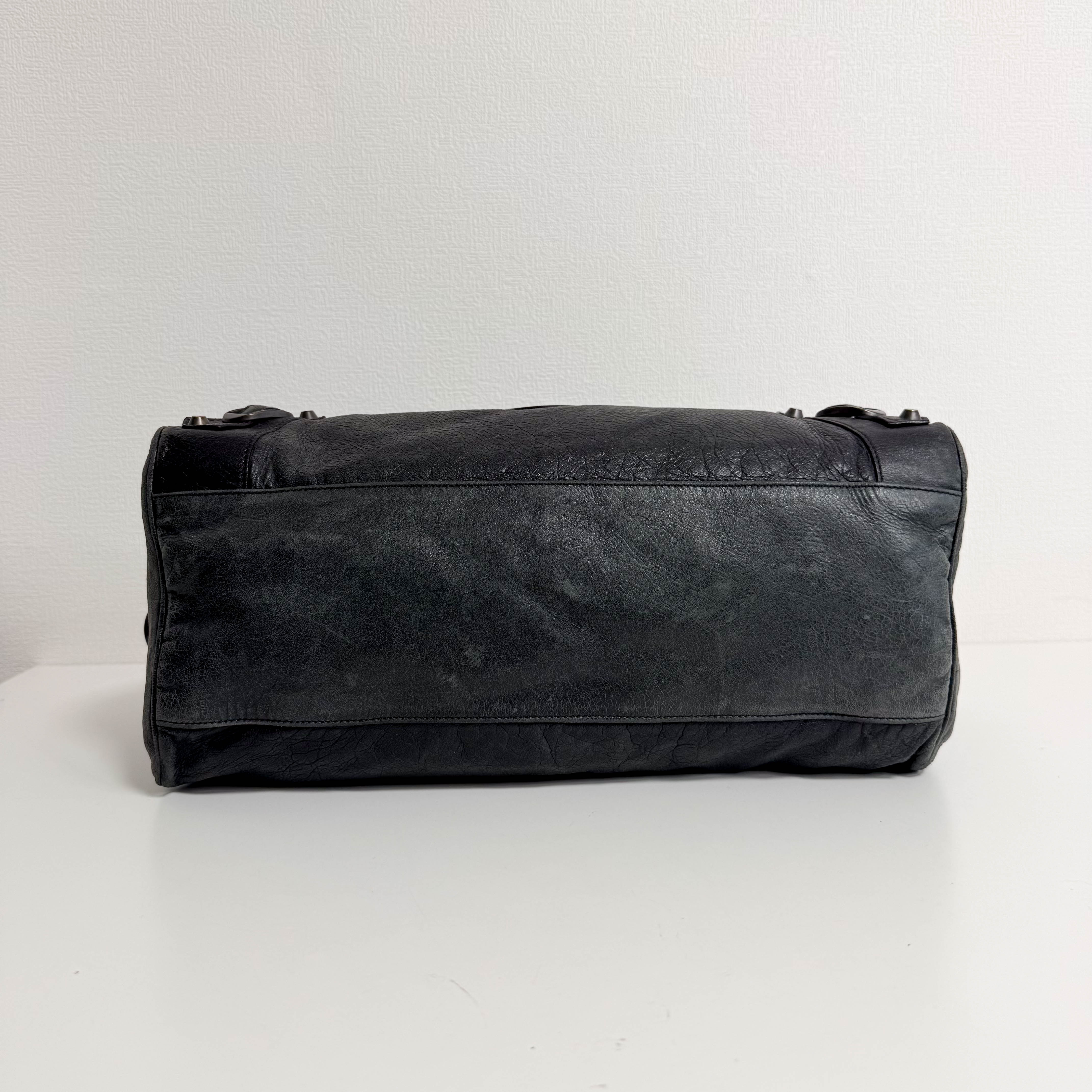 The First Black Leather Hand Bag