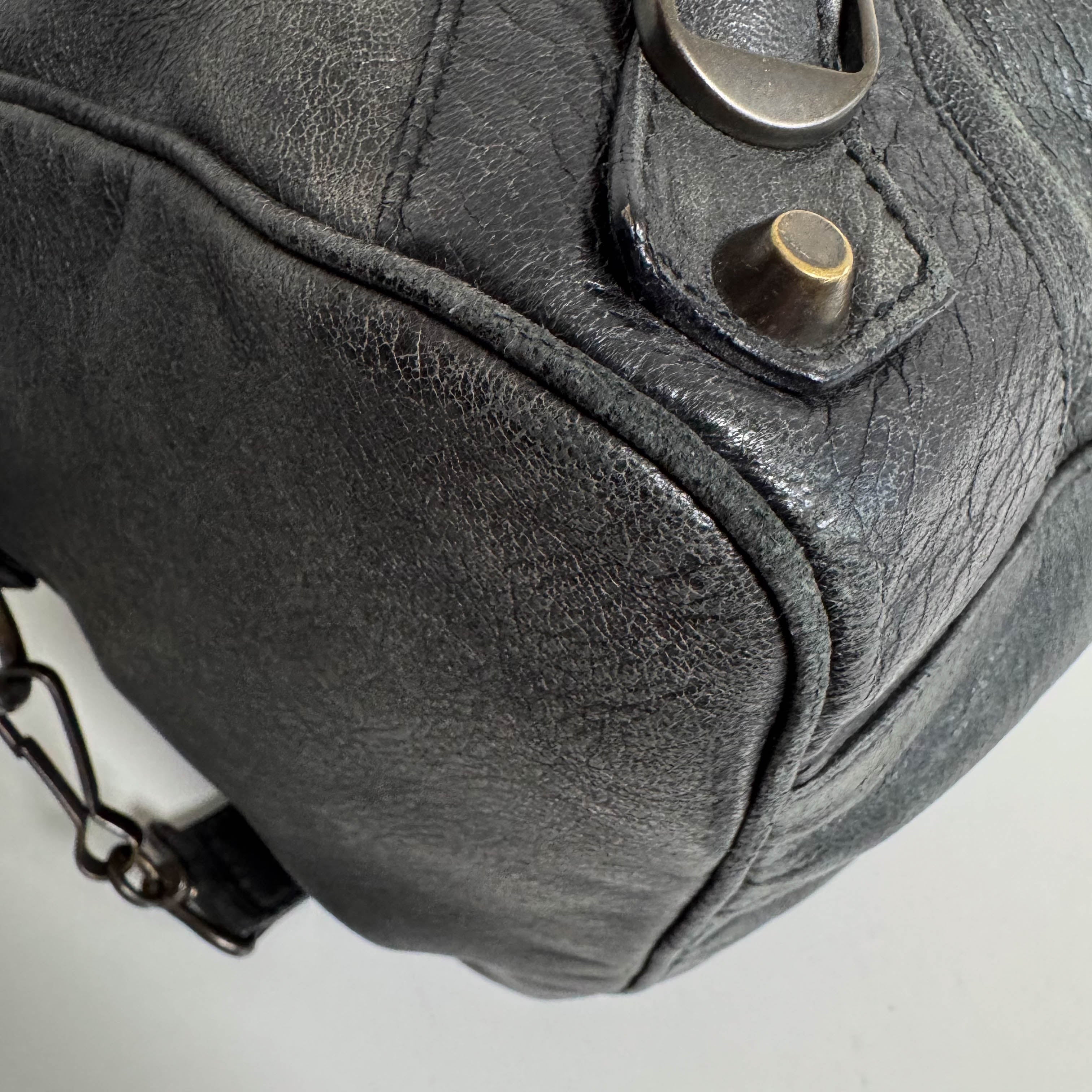 The First Black Leather Hand Bag