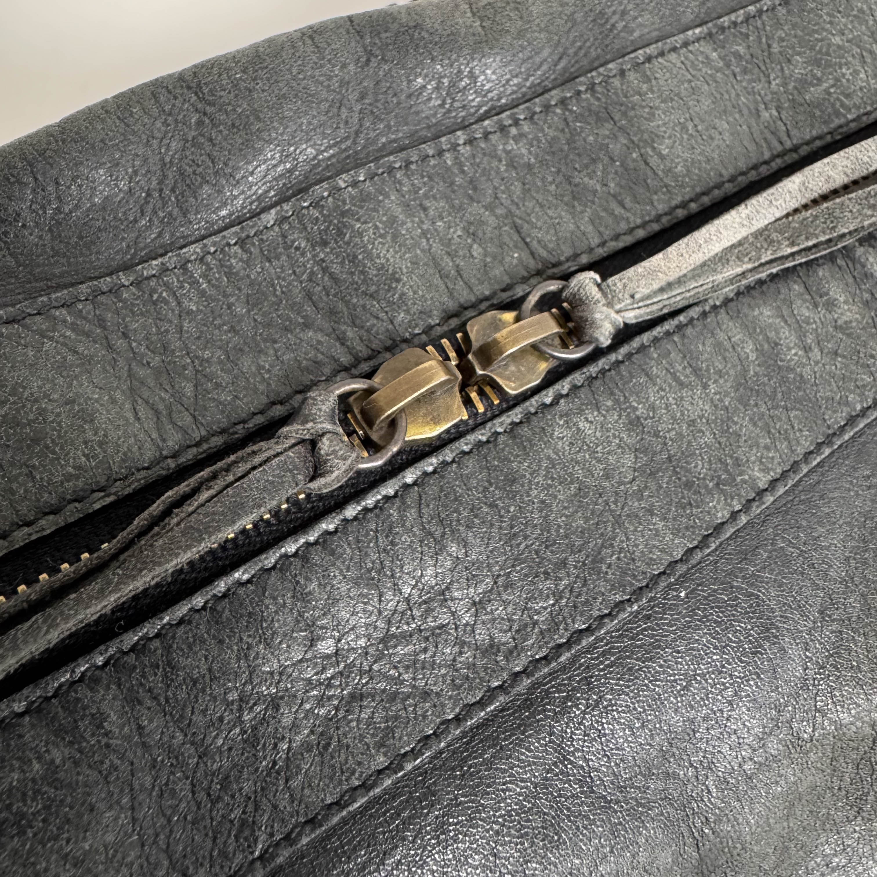 The First Black Leather Hand Bag