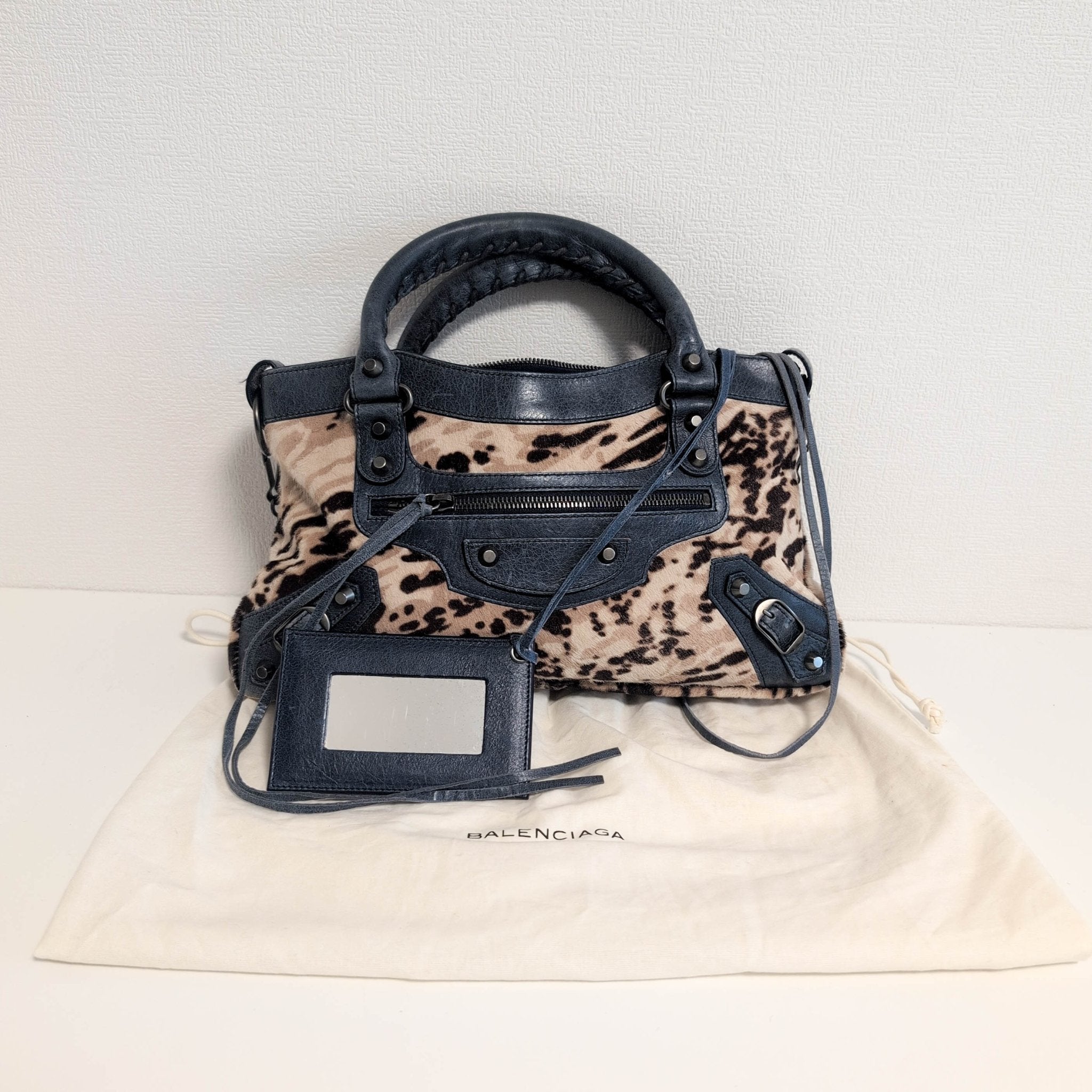 BALENCIAGA City The First Leopard Pony Hair with Navy Leather Handbag, in , Sold by HIVE PRELOVED - Handle Bags, Shoulder Bag