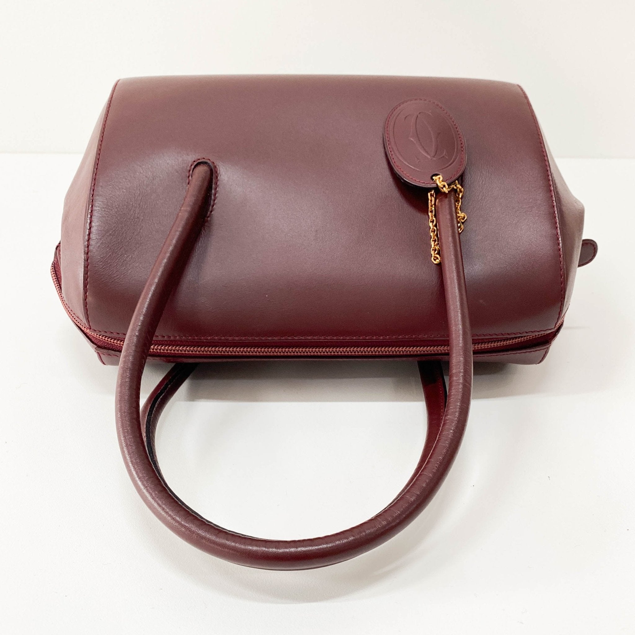 CARTIER Must Line Burgundy Leather Top Handle Bag, in , Sold by HIVE PRELOVED - Handle Bags, Shoulder Bags,