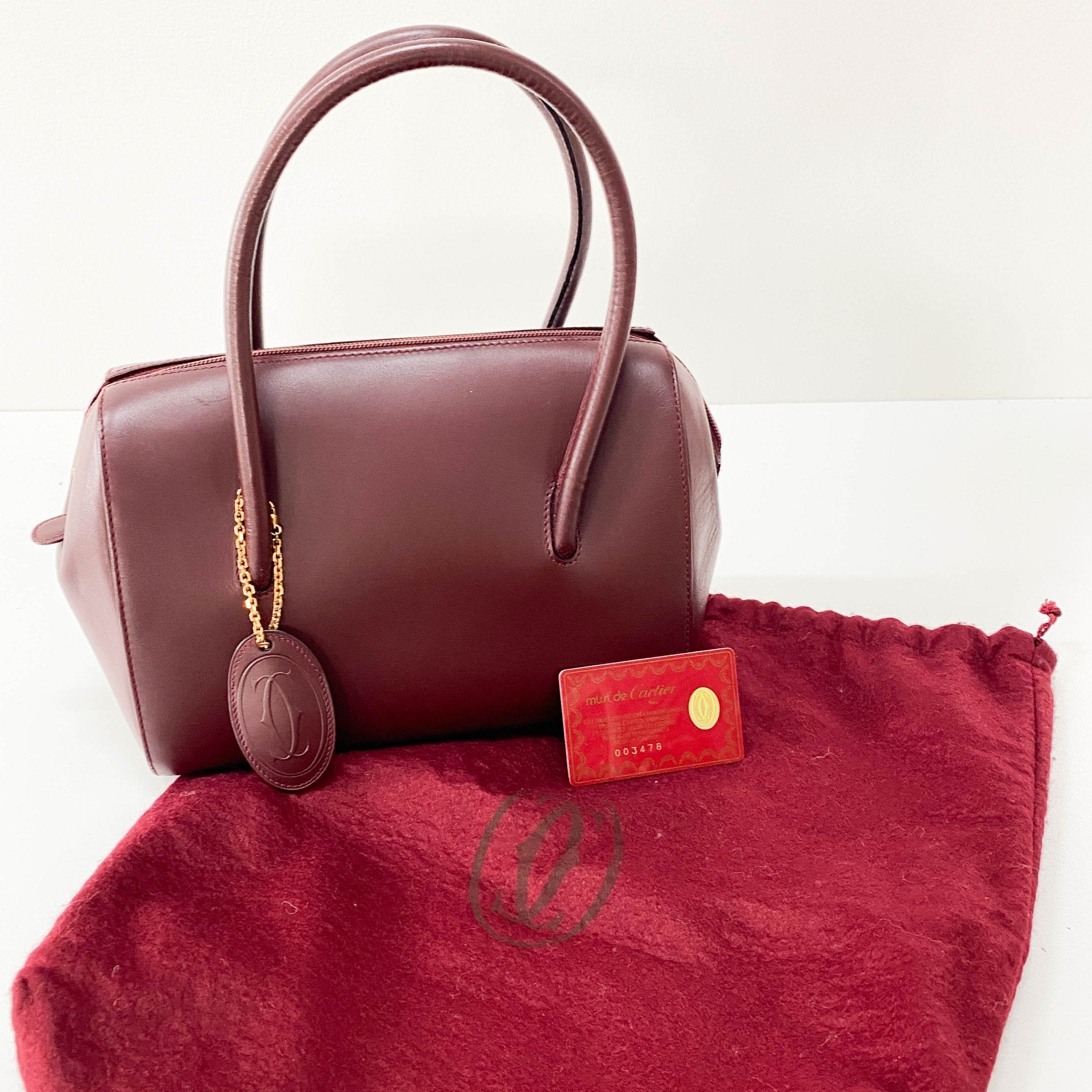 CARTIER Must Line Burgundy Leather Top Handle Bag, in , Sold by HIVE PRELOVED - Handle Bags, Shoulder Bags,