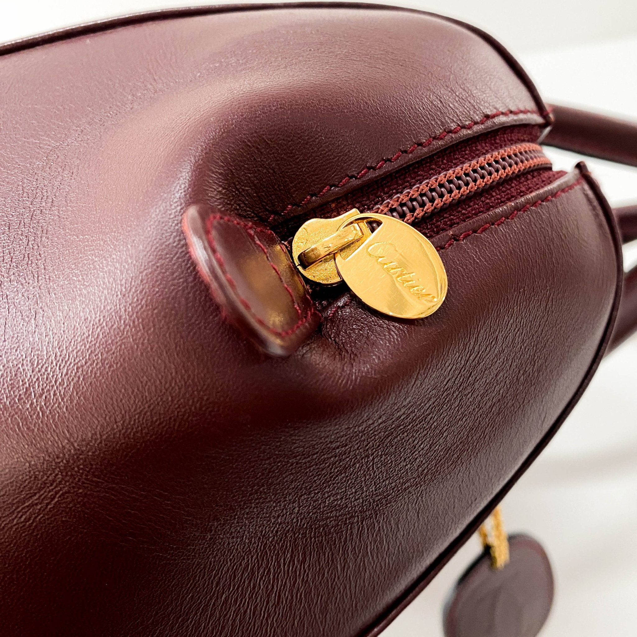 CARTIER Must Line Burgundy Leather Top Handle Bag, in , Sold by HIVE PRELOVED - Handle Bags, Shoulder Bags,