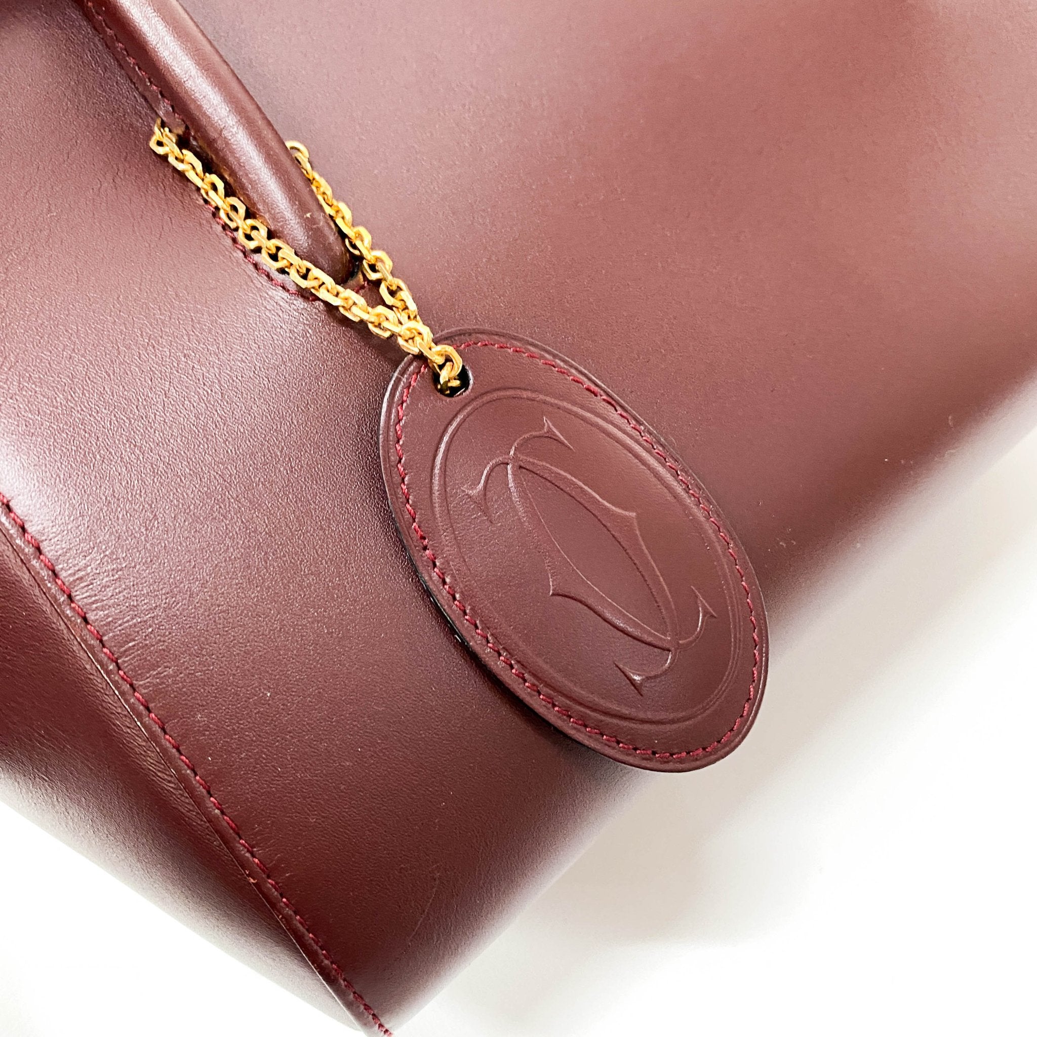 CARTIER Must Line Burgundy Leather Top Handle Bag, in , Sold by HIVE PRELOVED - Handle Bags, Shoulder Bags,