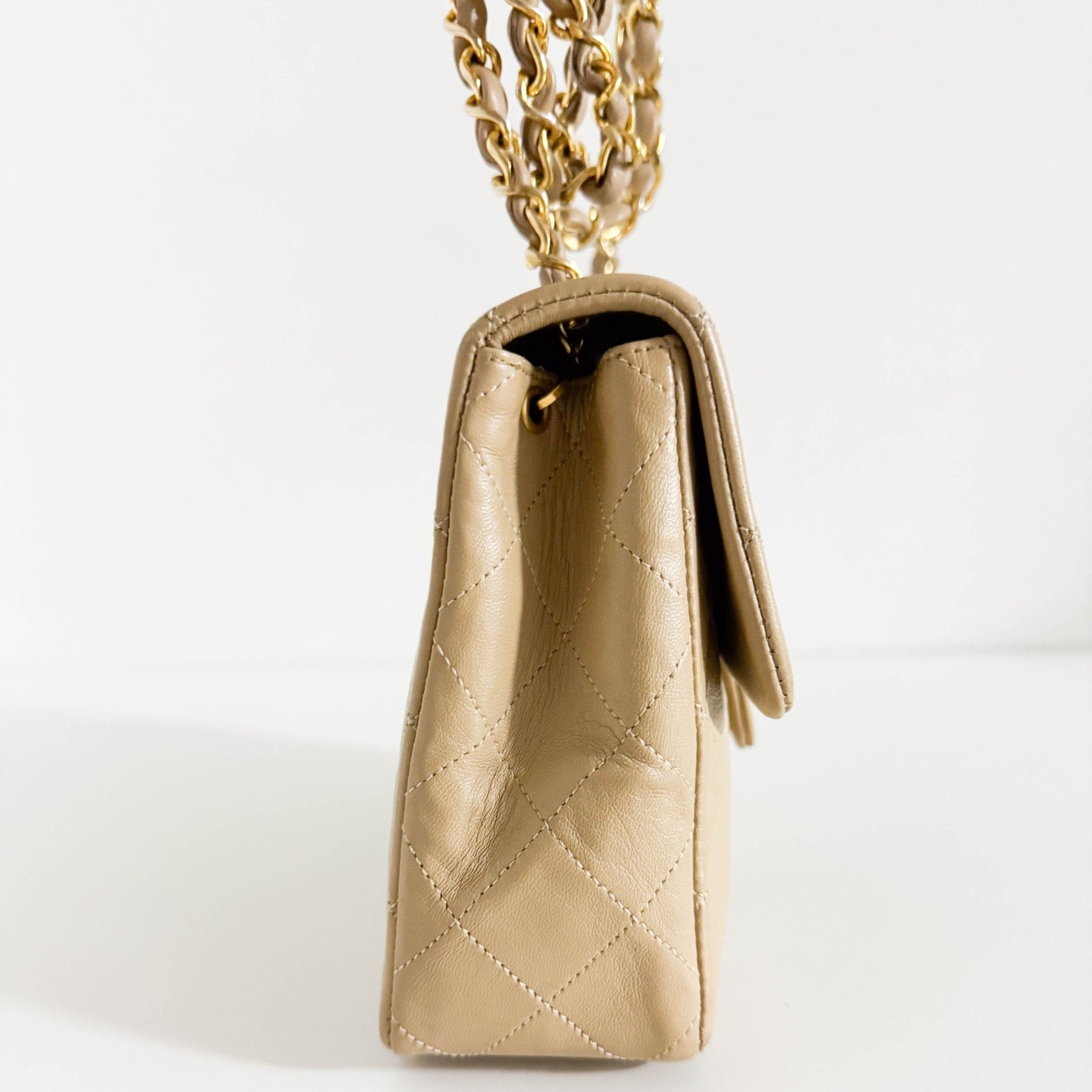 CHANEL Classic Flap Beige Lambskin Medium Gold Chain Shoulder Bag, in , Sold by HIVE PRELOVED - Crossbody bags, ,