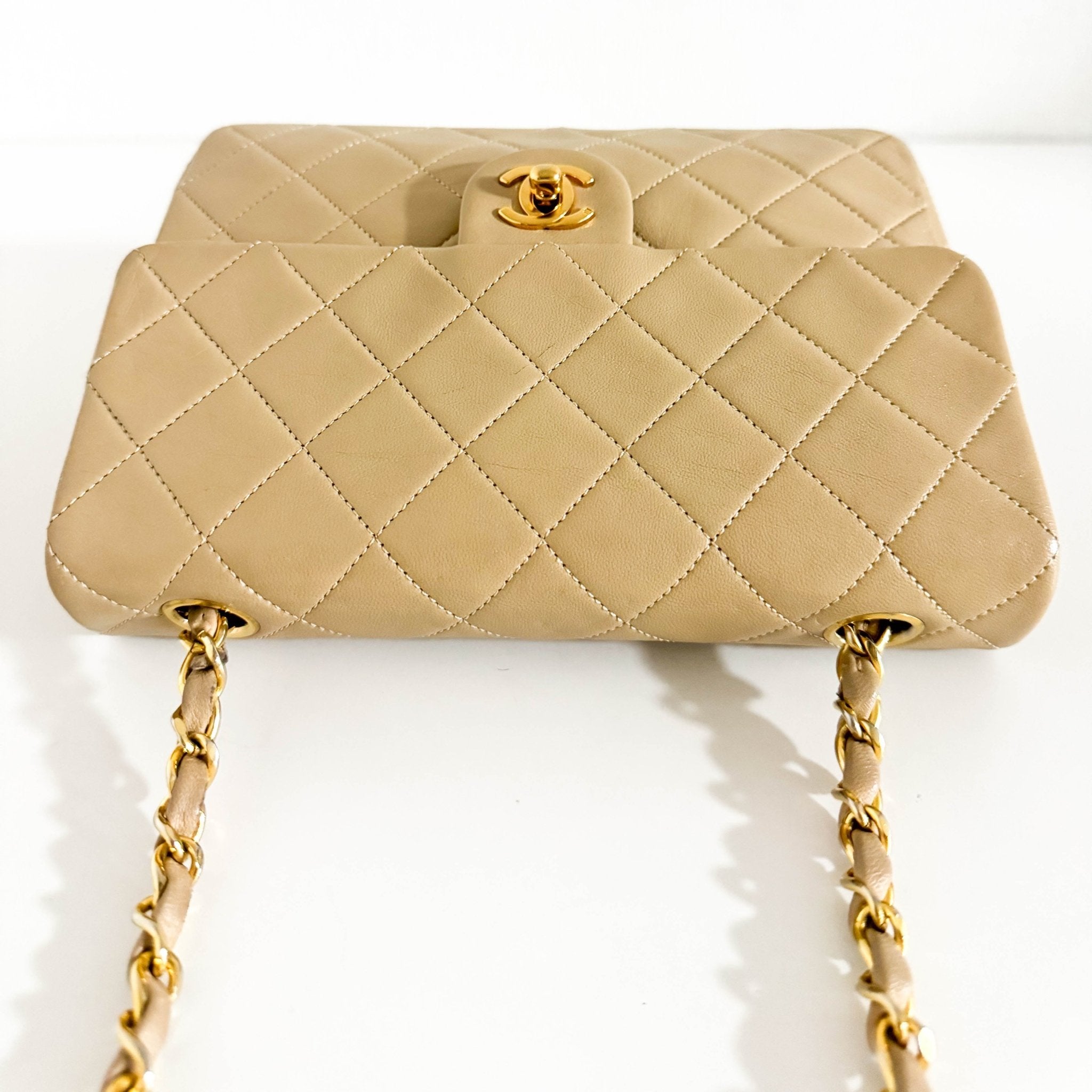 CHANEL Classic Flap Beige Lambskin Medium Gold Chain Shoulder Bag, in , Sold by HIVE PRELOVED - Crossbody bags, ,