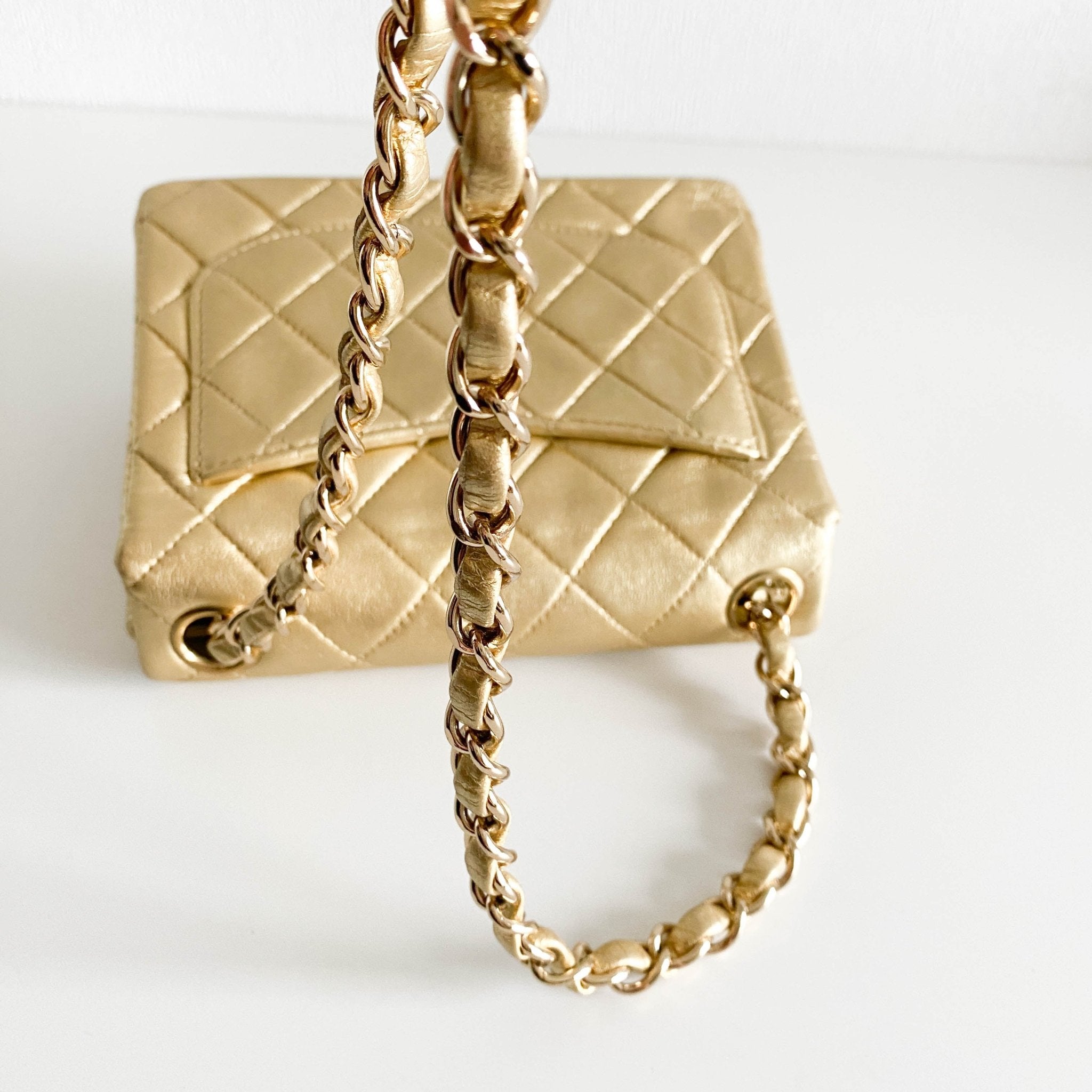 CHANEL Classic Flap Gold Lambskin Mini Gold Chain Shoulder Bag, in , Sold by HIVE PRELOVED - Crossbody bags, ,