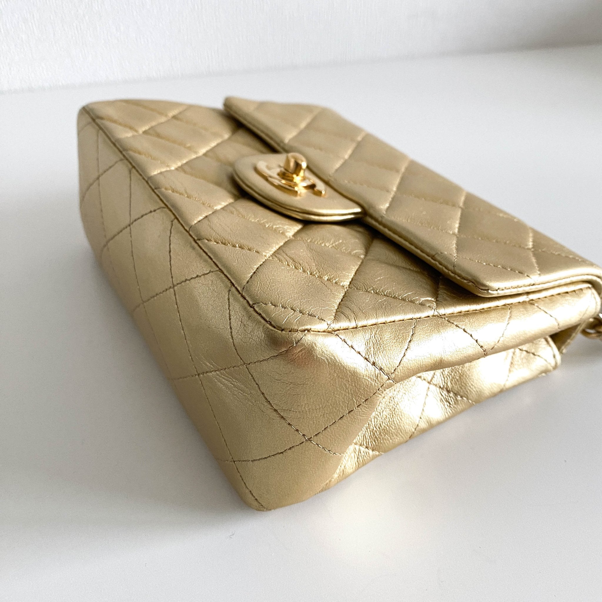 CHANEL Classic Flap Gold Lambskin Mini Gold Chain Shoulder Bag, in , Sold by HIVE PRELOVED - Crossbody bags, ,