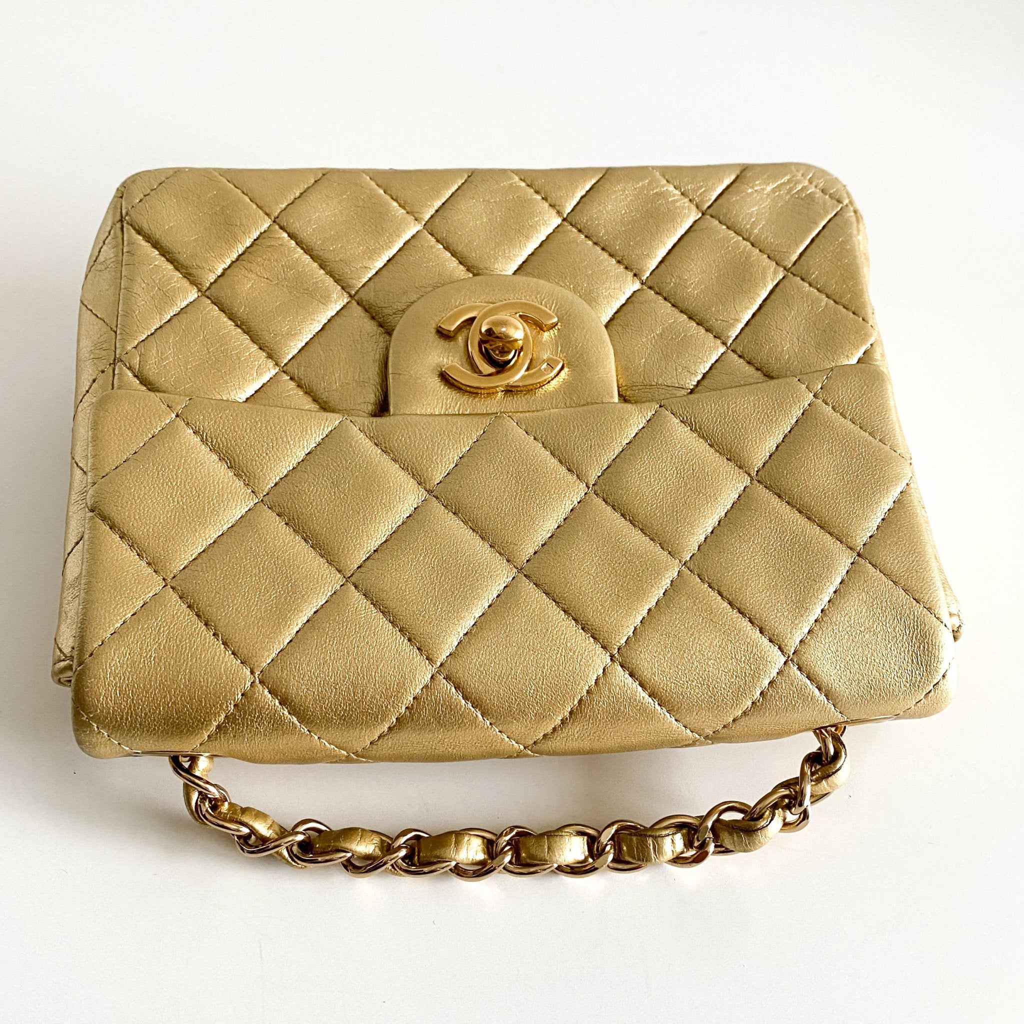 CHANEL Classic Flap Gold Lambskin Mini Gold Chain Shoulder Bag, in , Sold by HIVE PRELOVED - Crossbody bags, ,