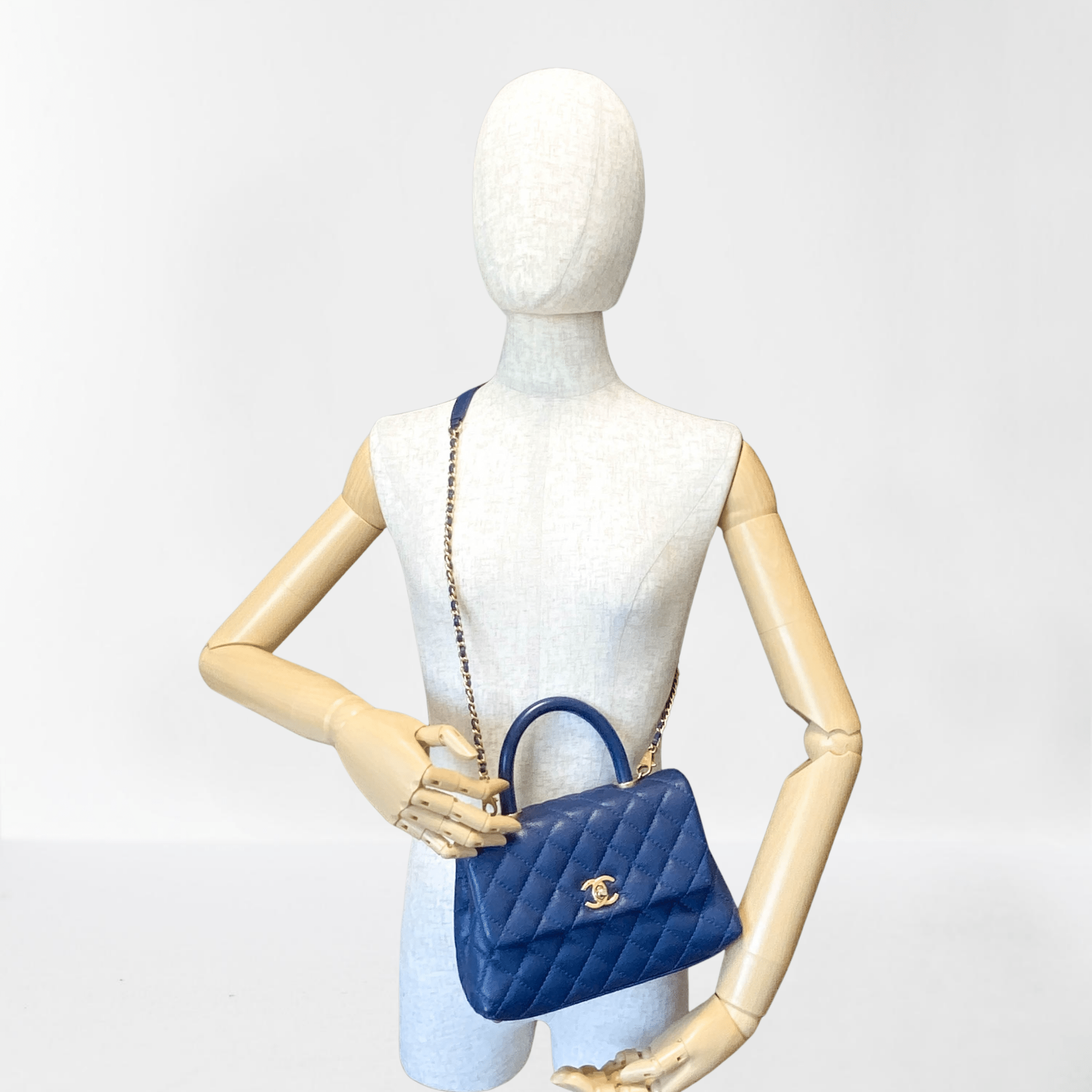 CHANEL Coco Handle Navy Grain Calf Leather Top Handle Bag with Gold Hardware, in Sold by HIVE PRELOVED Crossbody bags