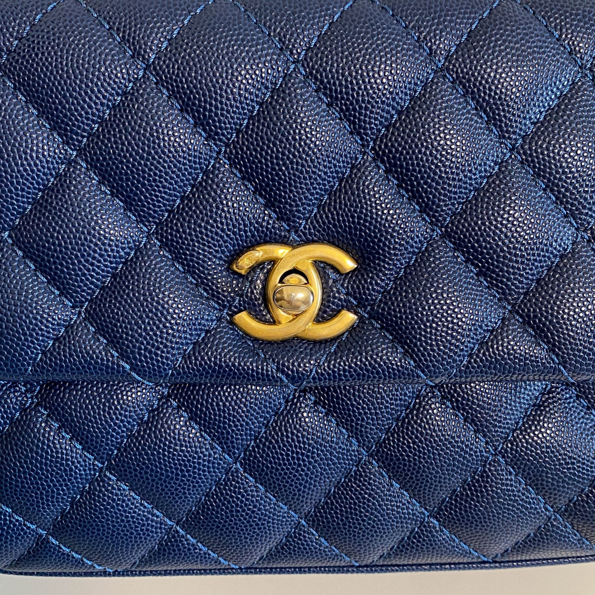 CHANEL Coco Handle Navy Grain Calf Leather Top Handle Bag with Gold Hardware, in Sold by HIVE PRELOVED Crossbody bags