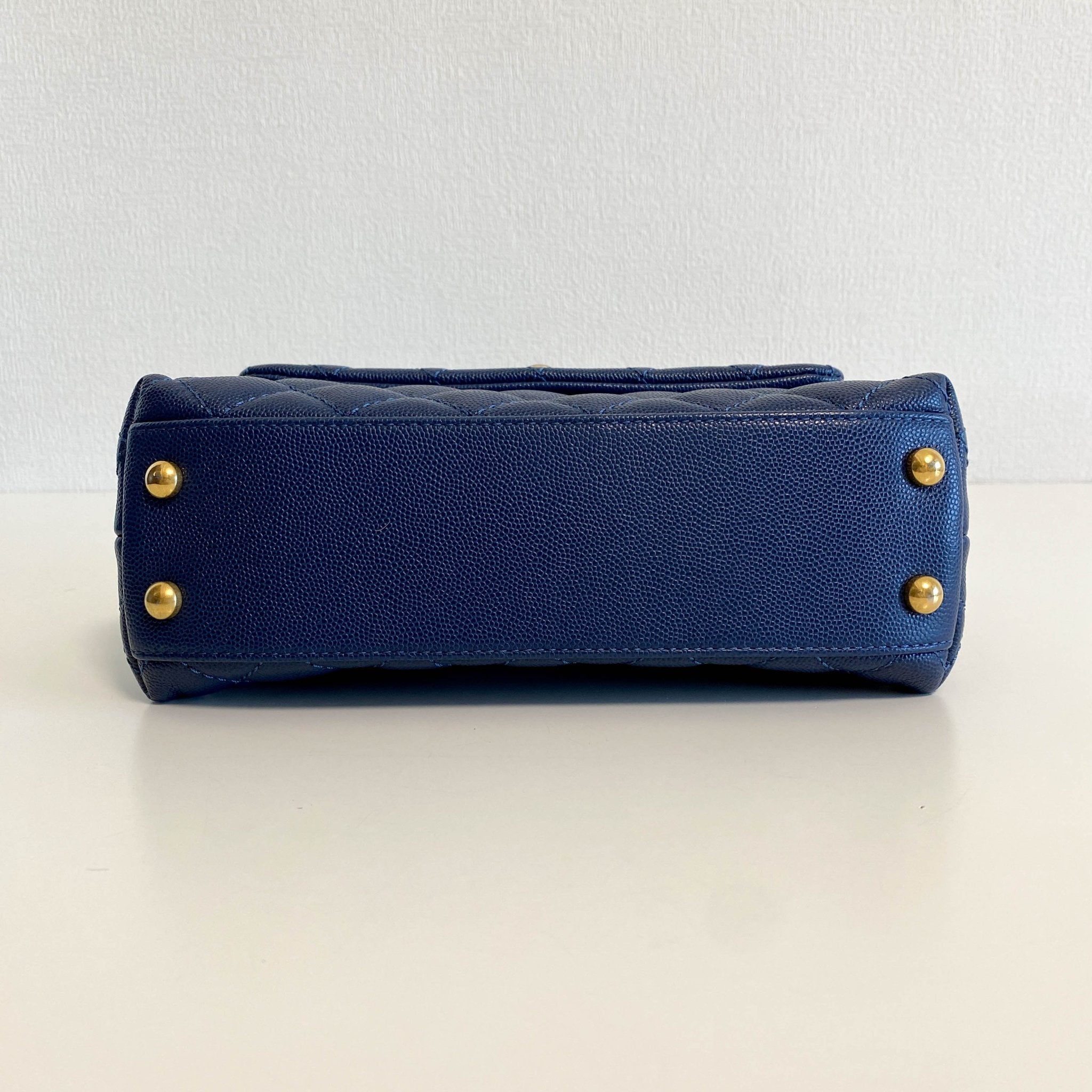 CHANEL Coco Handle Navy Grain Calf Leather Top Handle Bag with Gold Hardware, in Sold by HIVE PRELOVED Crossbody bags