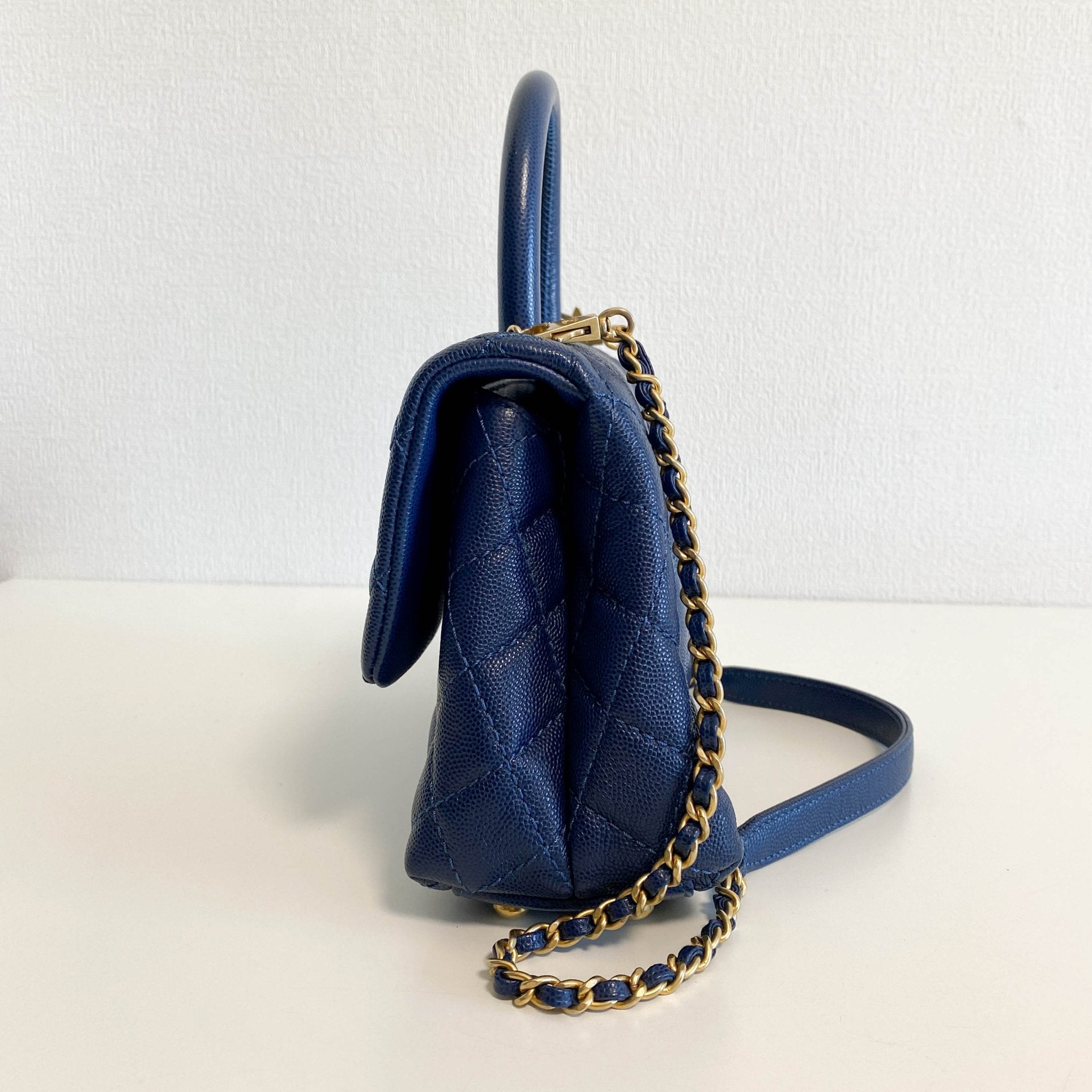 CHANEL Coco Handle Navy Grain Calf Leather Top Handle Bag with Gold Hardware, in Sold by HIVE PRELOVED Crossbody bags