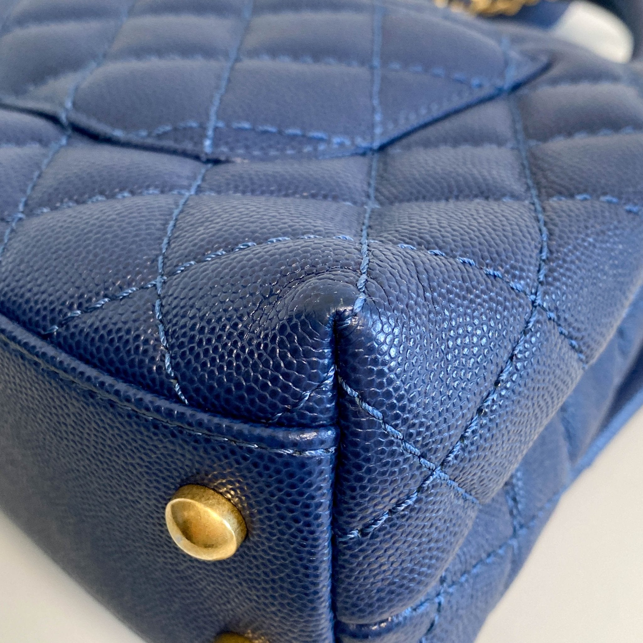 CHANEL Coco Handle Navy Grain Calf Leather Top Handle Bag with Gold Hardware, in Sold by HIVE PRELOVED Crossbody bags