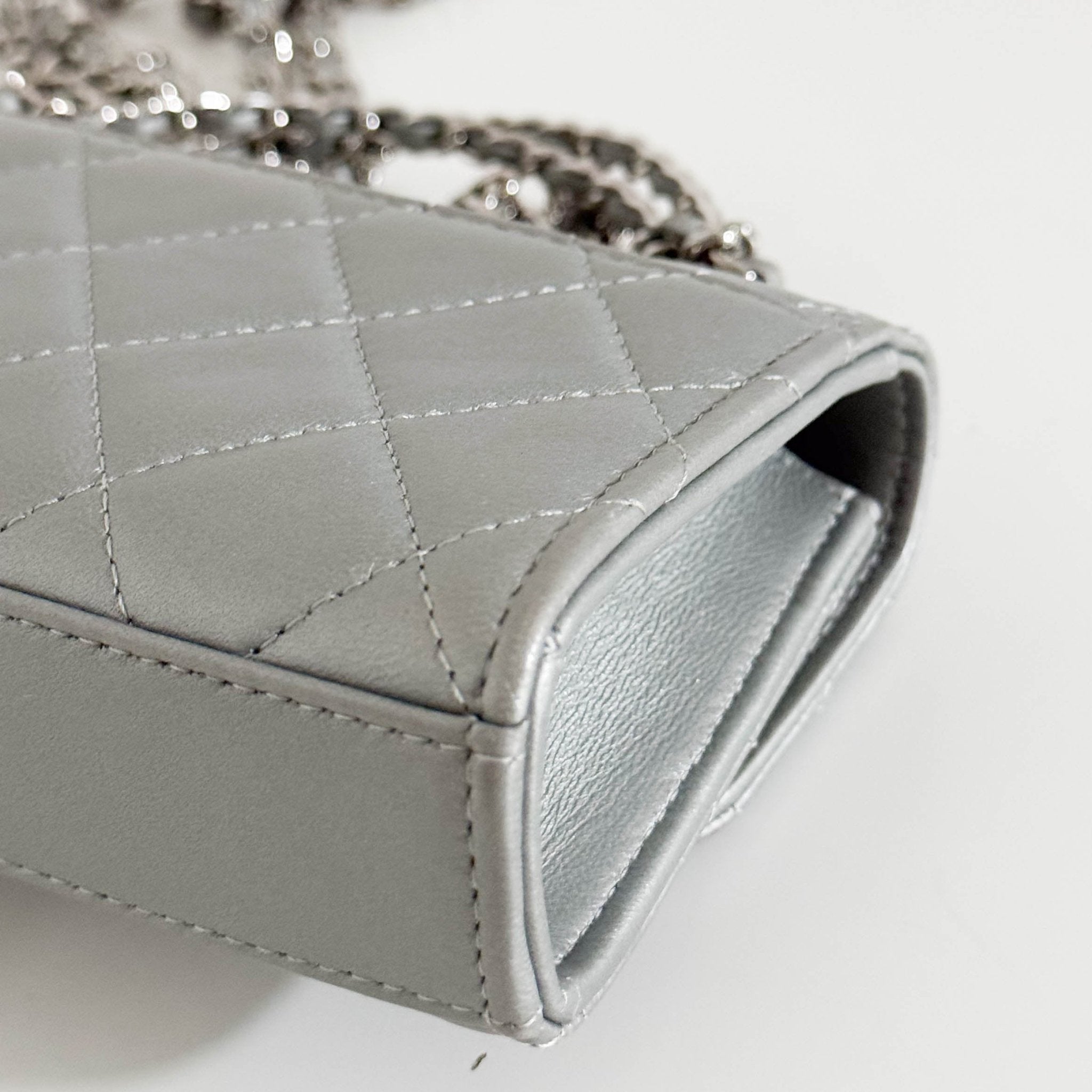 CHANEL Timeless Classic Top Handle Flap Silver Lambskin Mini Chain Wallet Shoulder Bag in  Sold by HIVE PRELOVED