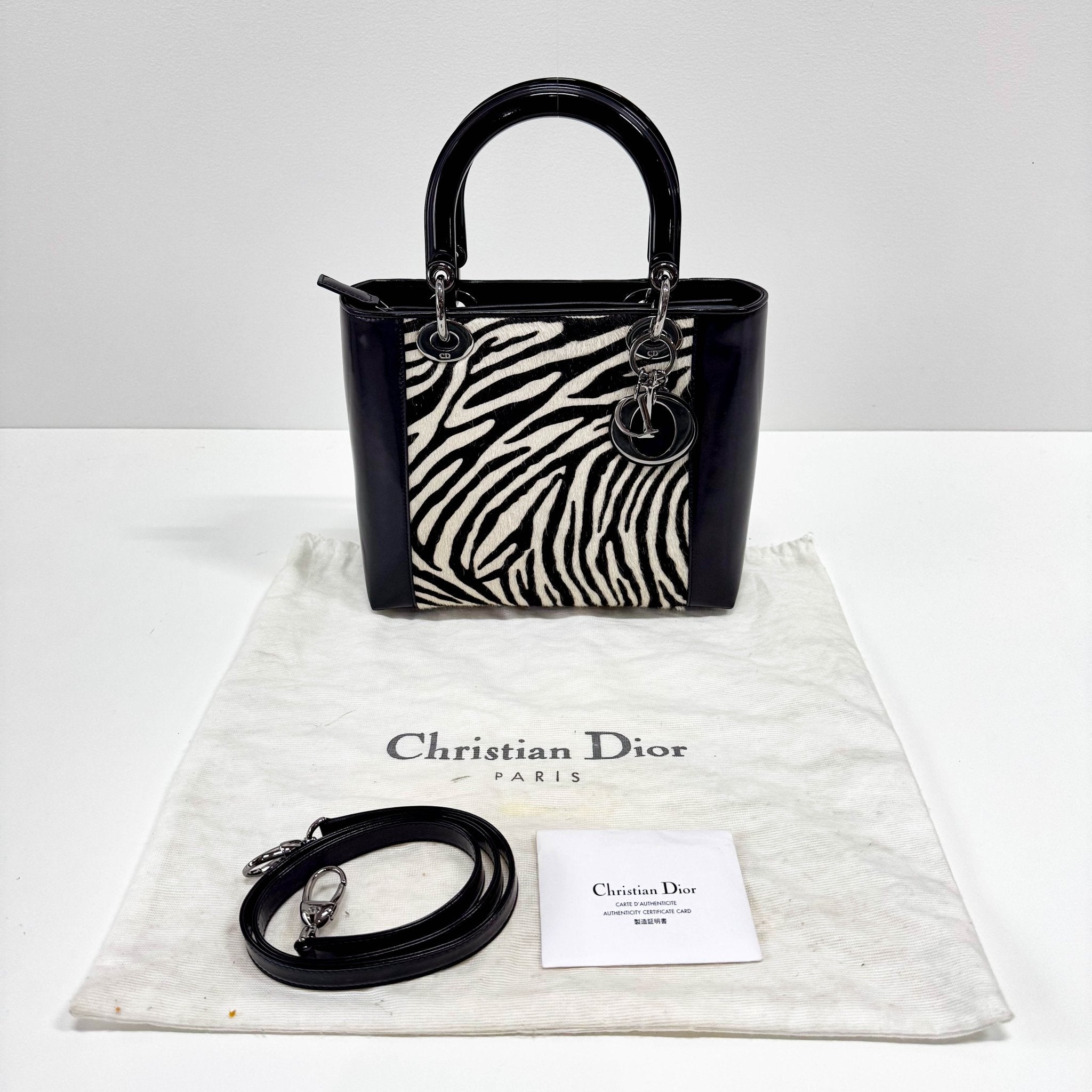 DIOR Black Patent Leather and Zebra Pony Hair Lady Dior Handbag, in , Sold by HIVE PRELOVED - Handle Bags, ,