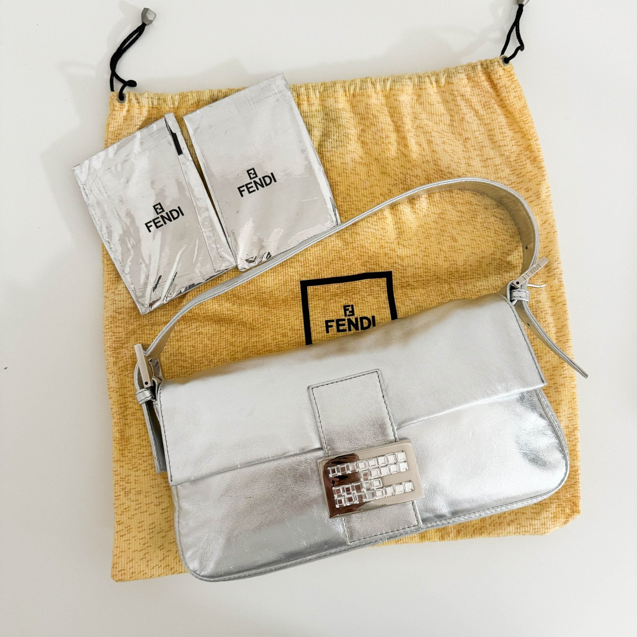 FENDI Baguette Metallic Silver Leather Rhinestone Hardware Shoulder Bag, in , Sold by HIVE PRELOVED - Shoulder Bags, ,