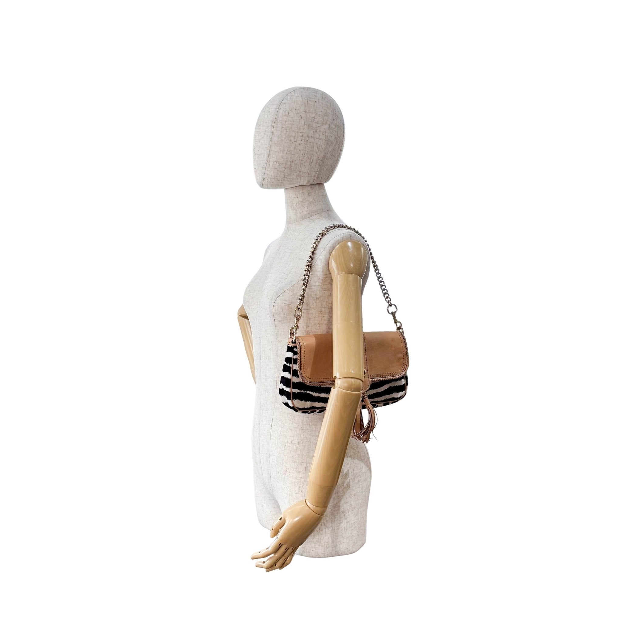 GUCCI Marrakech Zebra Print Pony Hair with Caramel Leather Flap and Tassels Gold Chain Shoulder Bag in Sold by HIVE PRELOVED