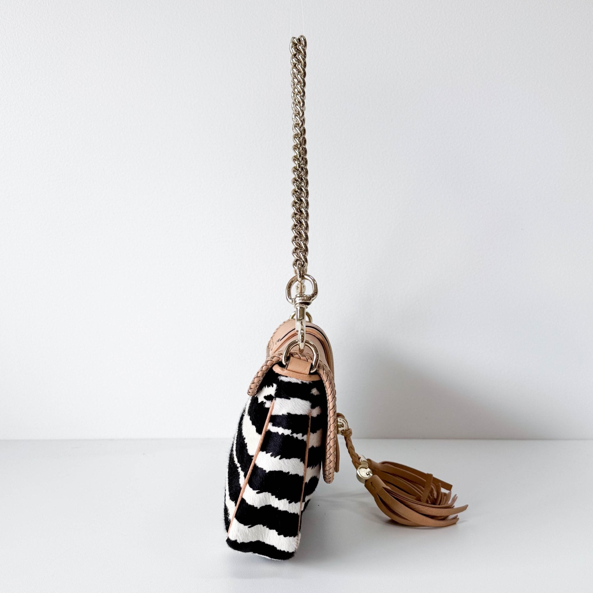 GUCCI Marrakech Zebra Print Pony Hair with Caramel Leather Flap and Tassels Gold Chain Shoulder Bag in Sold by HIVE PRELOVED