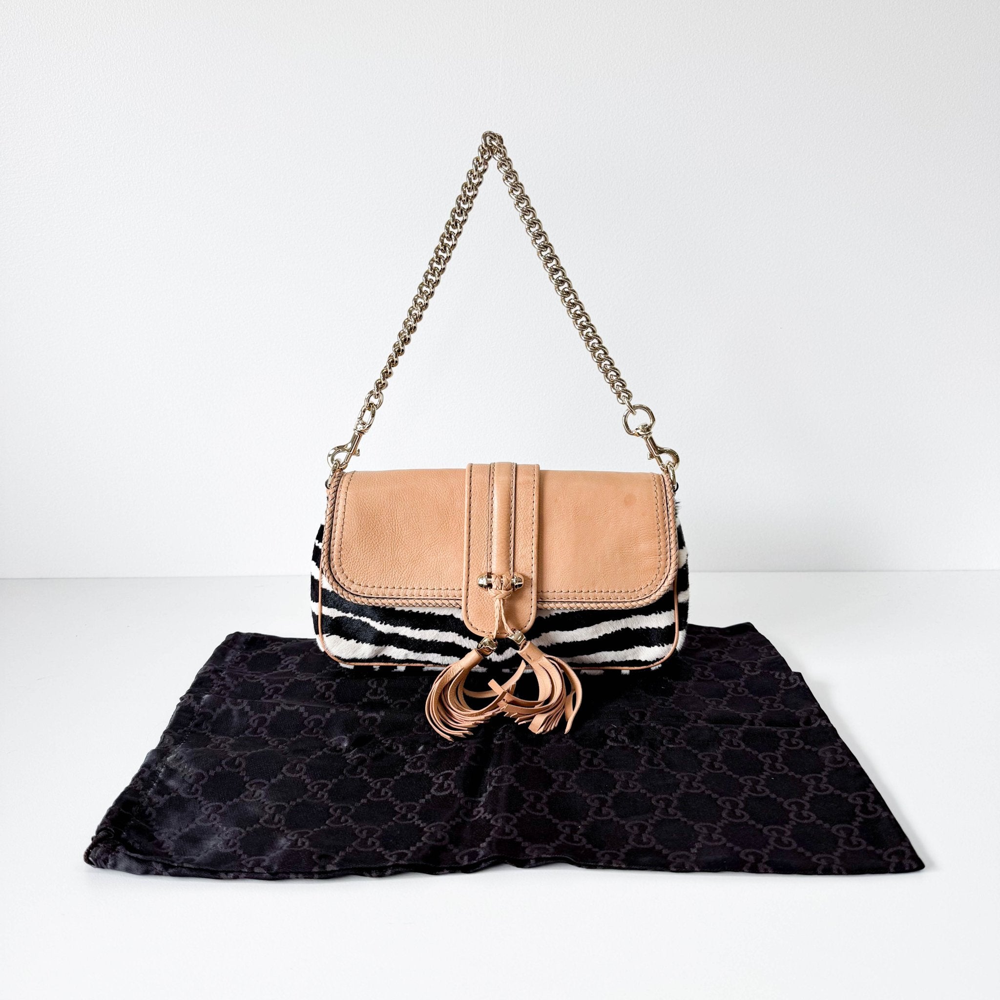 GUCCI Marrakech Zebra Print Pony Hair with Caramel Leather Flap and Tassels Gold Chain Shoulder Bag in Sold by HIVE PRELOVED